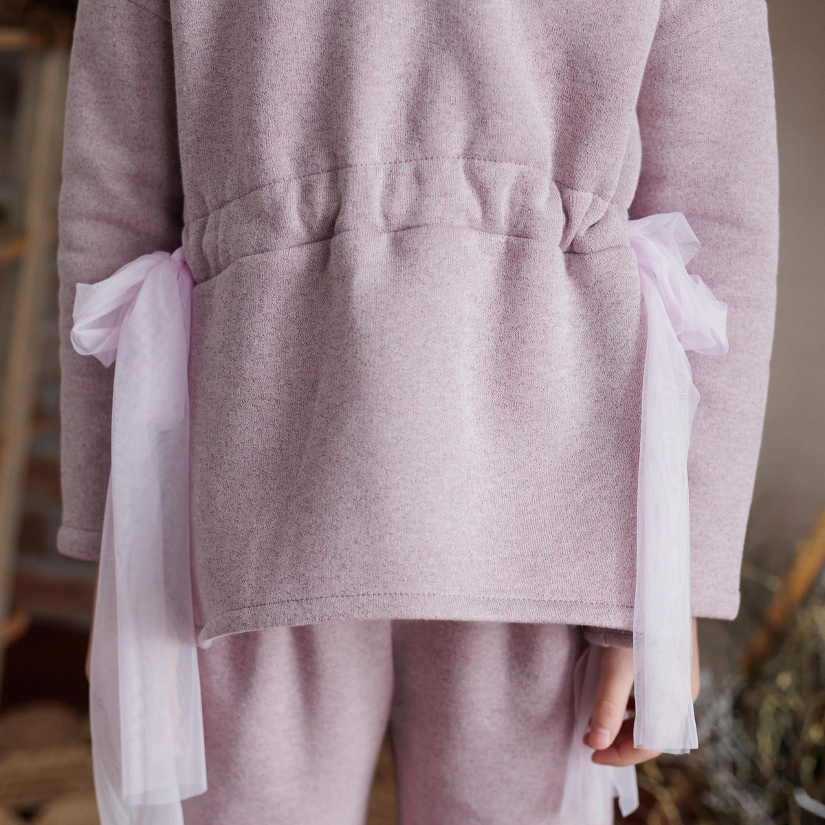 MAGLIA FELPA LUREX CON FIOCCHI IN VITA