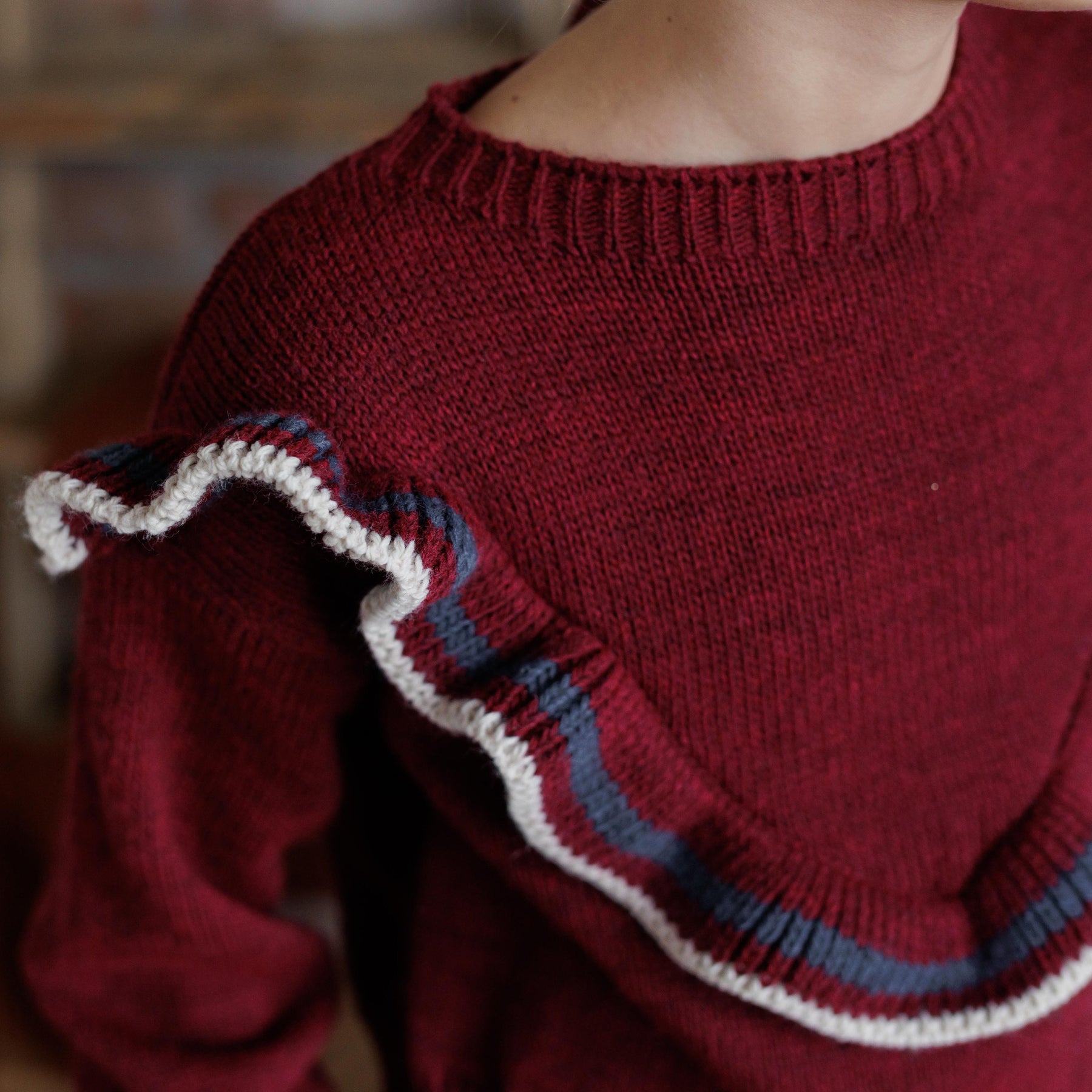PULLOVER CON FRAPPE