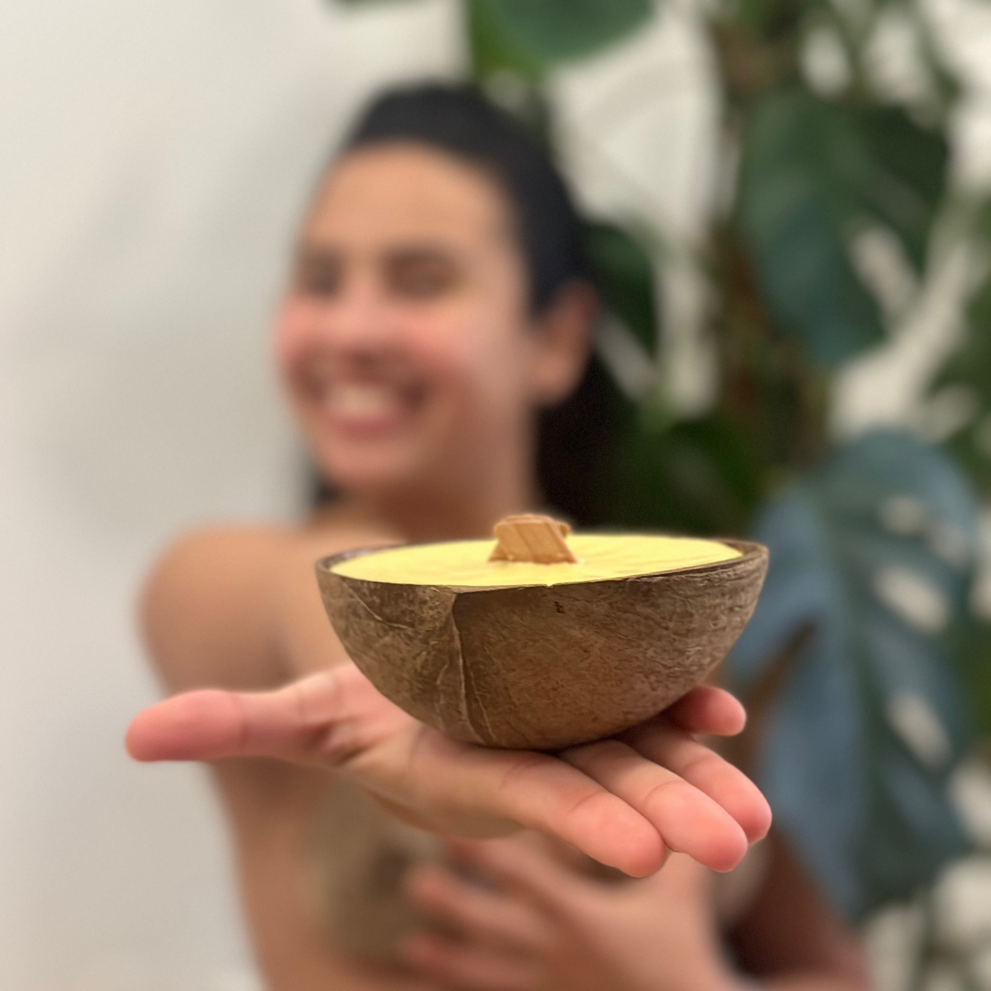 Wood wick candle in a coconut shell.  Beeswax & Coconut Wax - CocoBee.