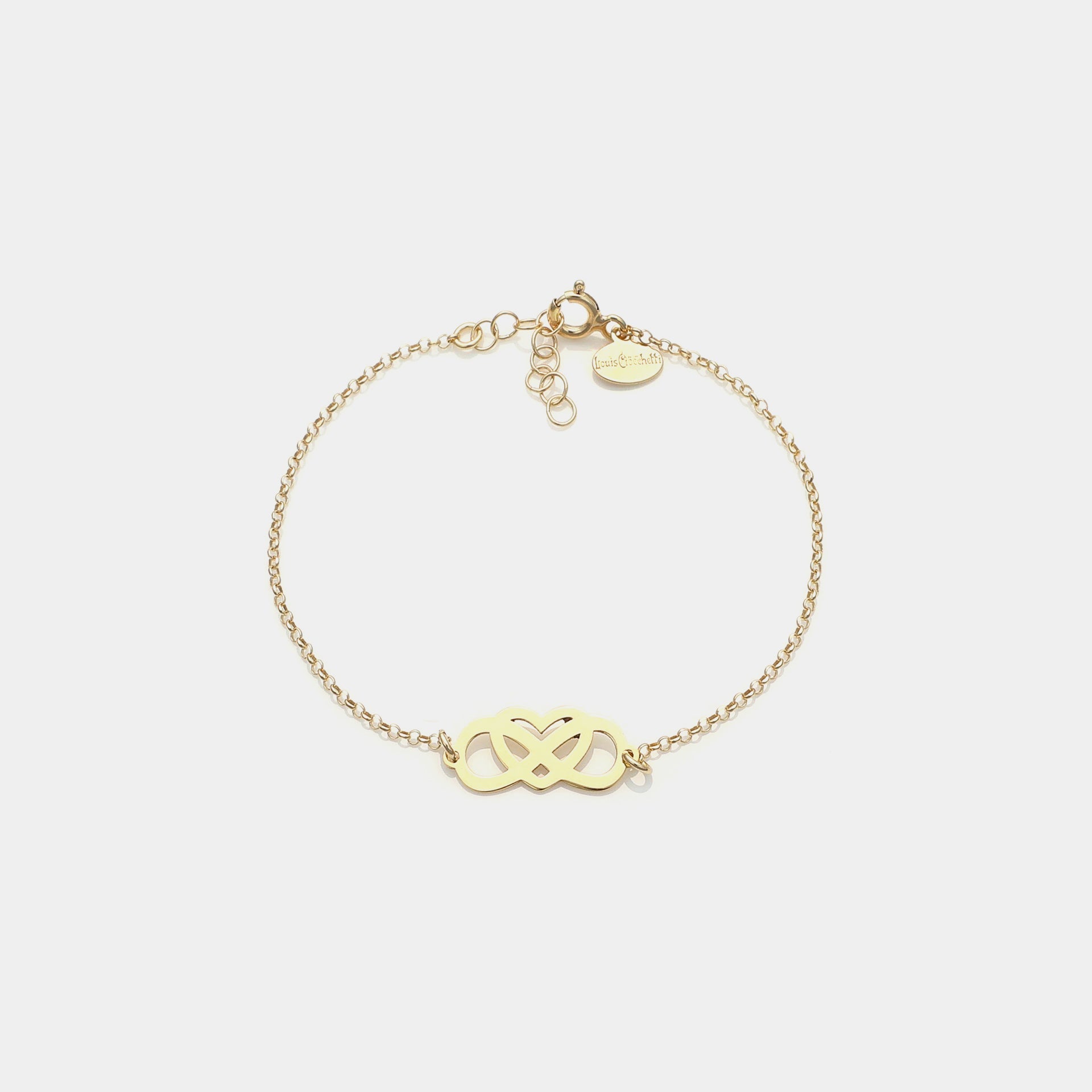 Gold-plated silver bracelet with intertwined and perforated infinity center and heart