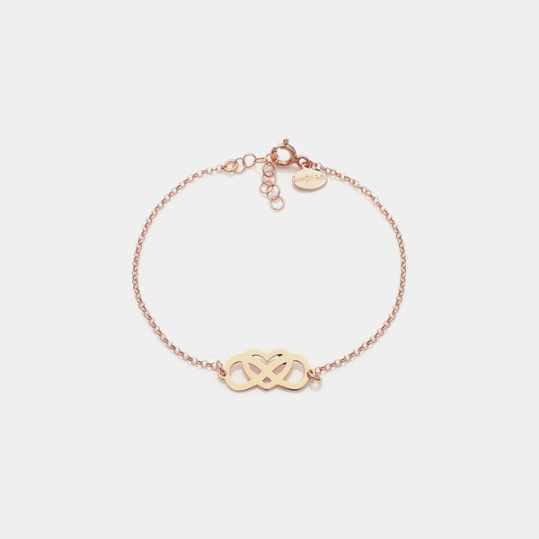 Rose gold plated silver bracelet with intertwined and perforated infinity center and heart