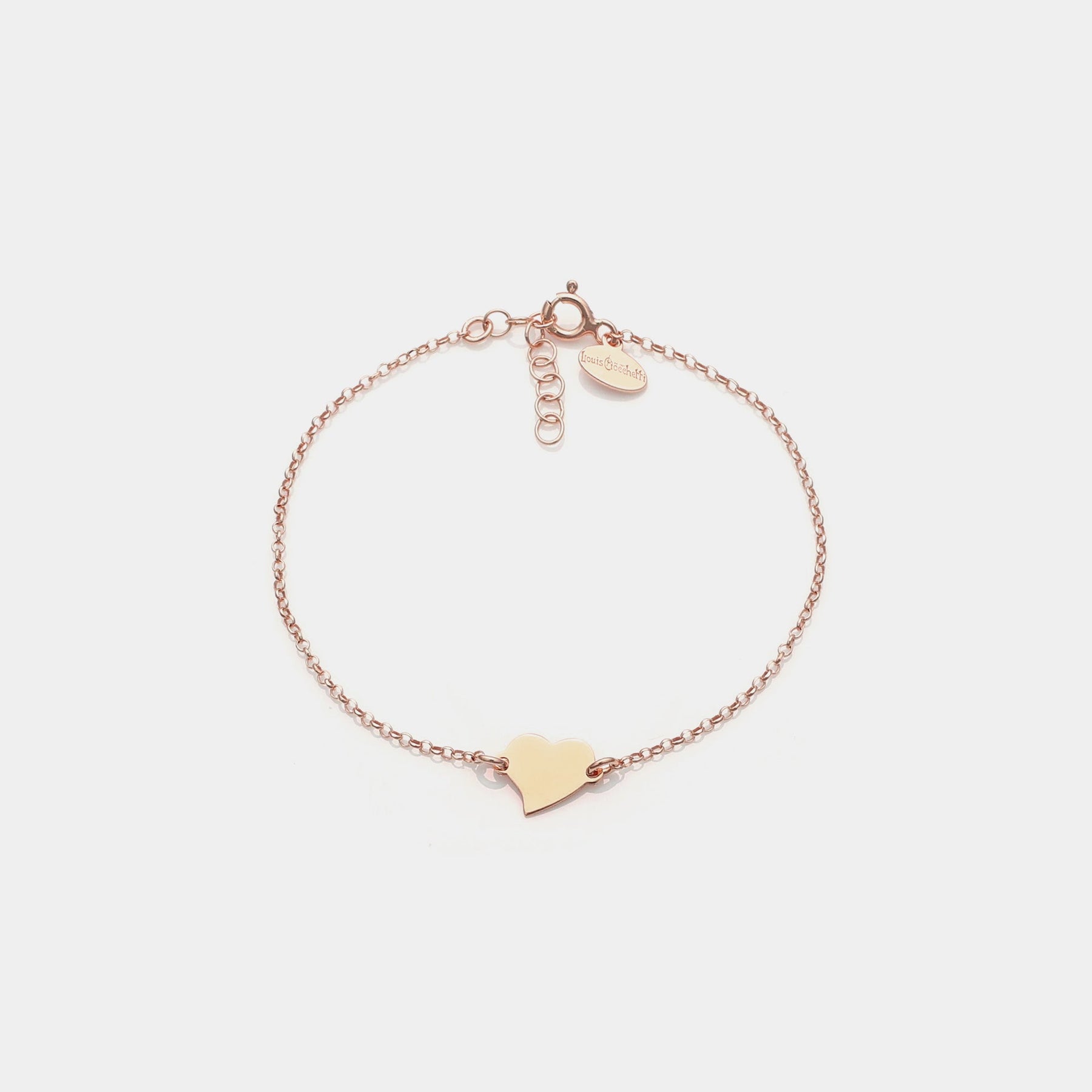 Rose gold silver bracelet with twisted heart centerpiece