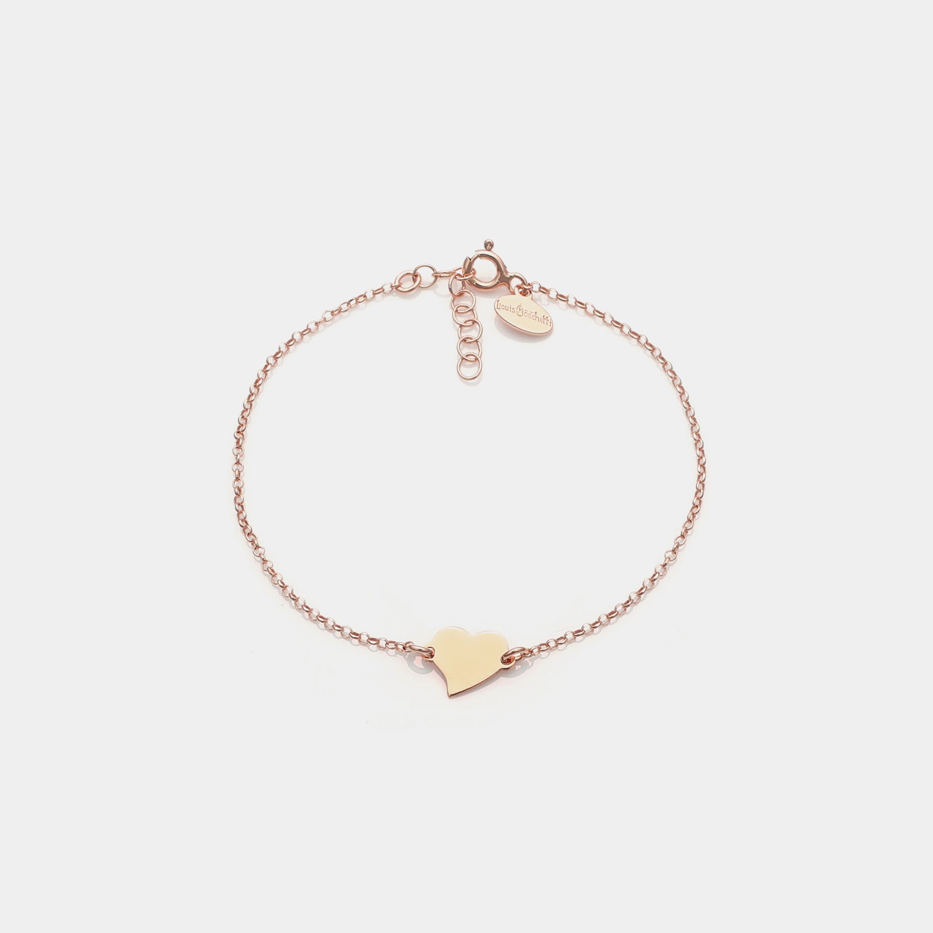 Rose gold silver bracelet with twisted heart centerpiece