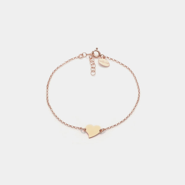 Rose gold silver bracelet with twisted heart centerpiece