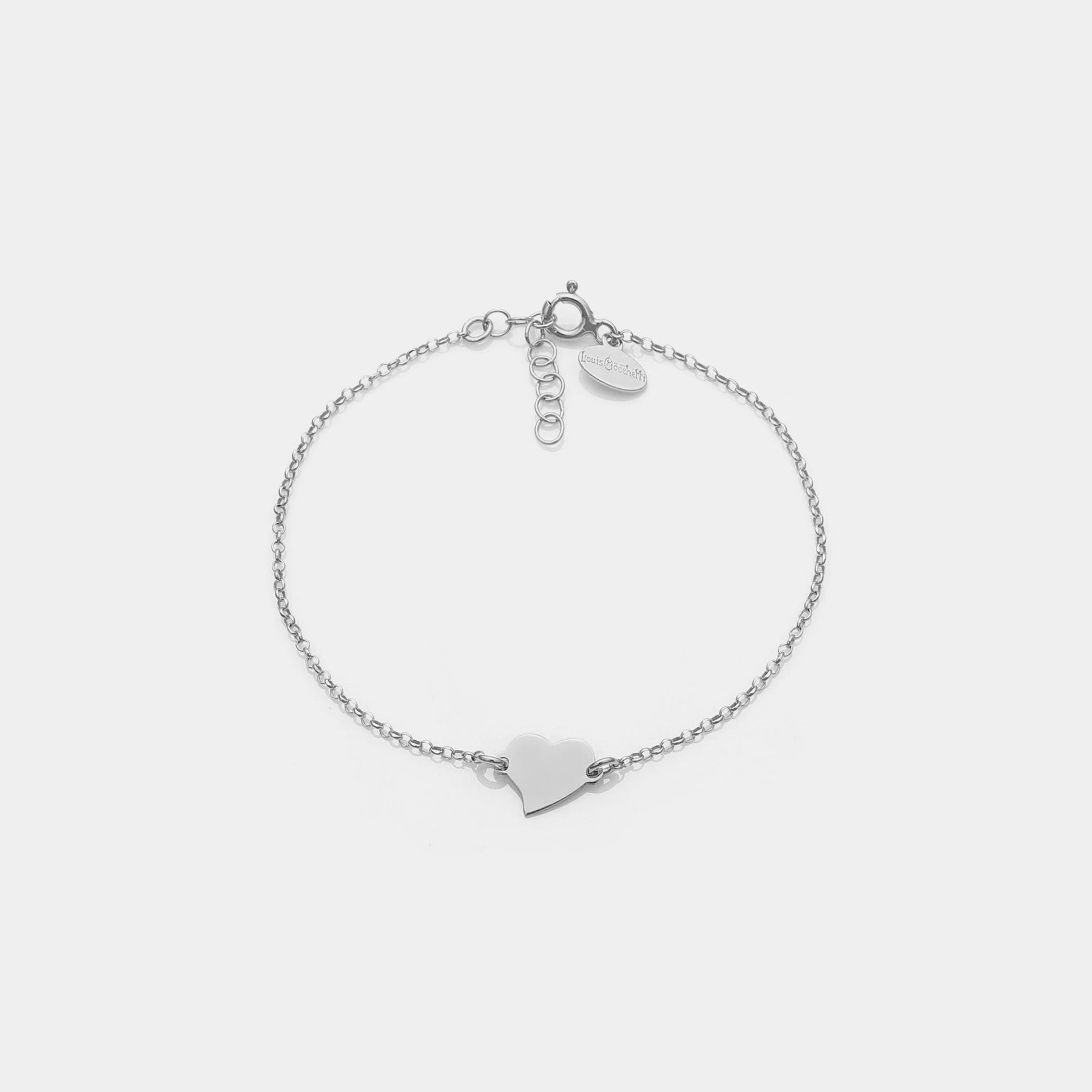 Rhodium-plated silver bracelet with twisted heart centerpiece
