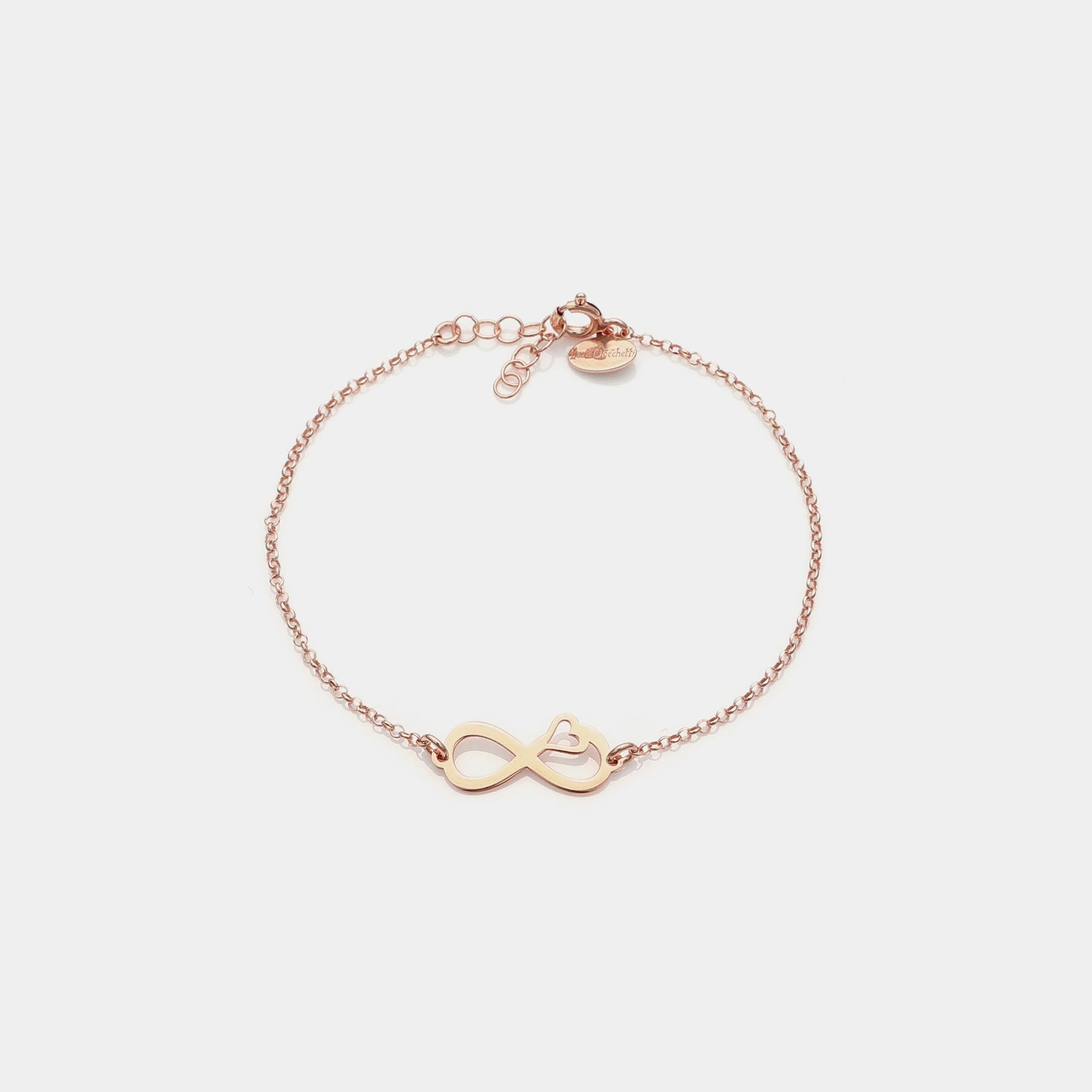 Rose gold plated silver bracelet with pierced infinity center and side heart