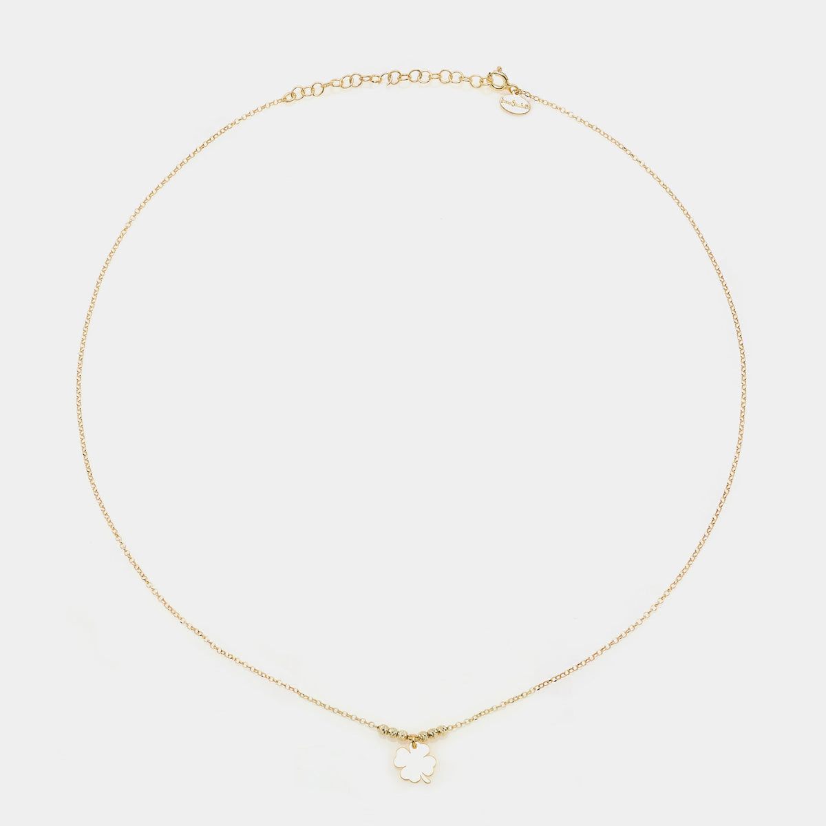 Gold-plated silver necklace with a central hanging four-leaf clover and 3 faceted spheres on the sides