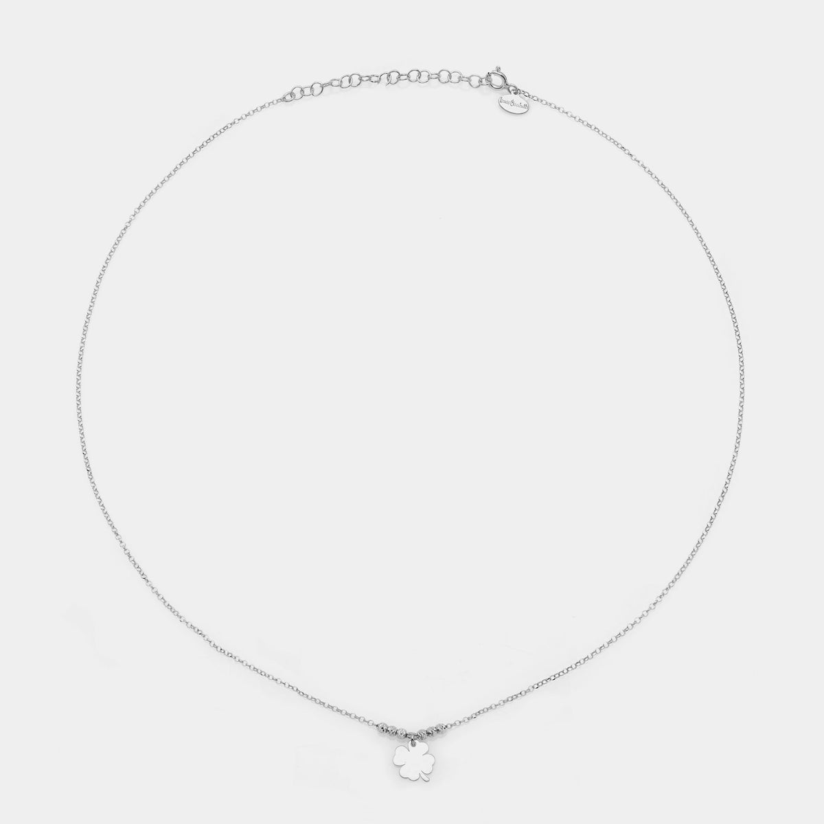 Rhodium-plated silver necklace with a central pendant clover and 3 faceted spheres on the sides