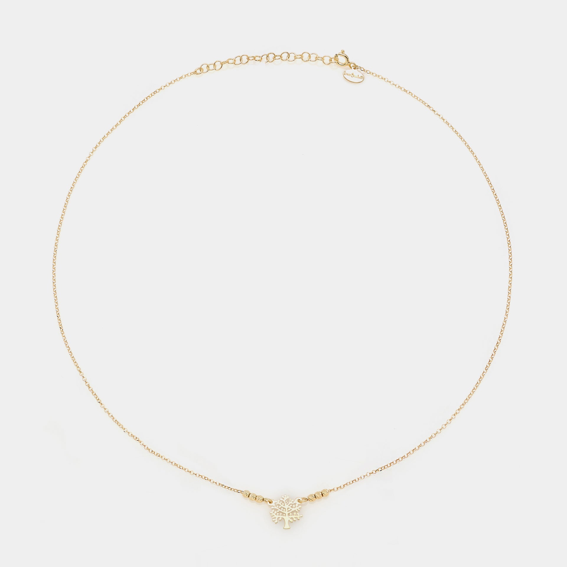 Gold-plated silver necklace with pierced tree of life centerpiece and 3 faceted spheres on the sides
