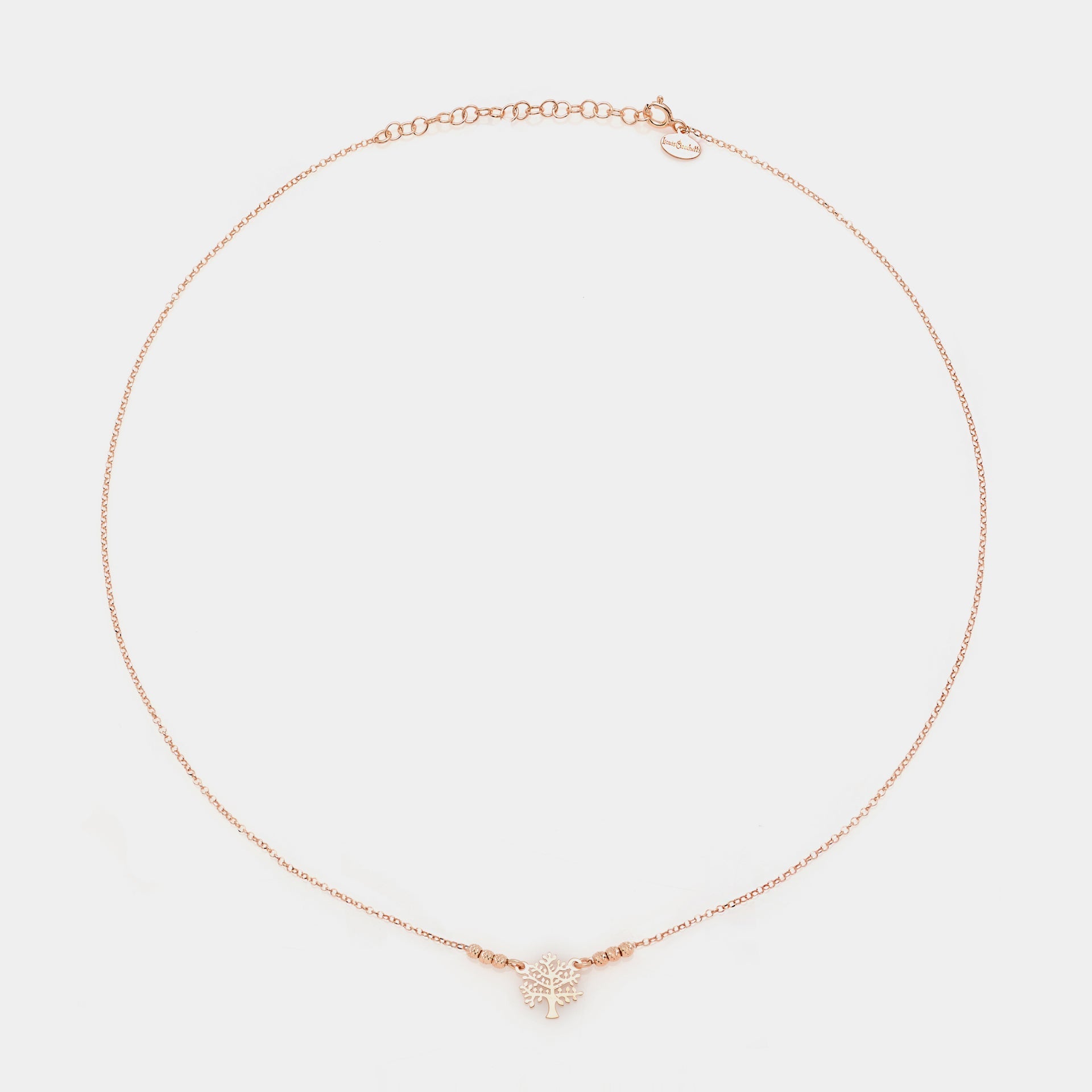 Rose gold silver necklace with pierced tree of life centerpiece and 3 faceted spheres on the sides