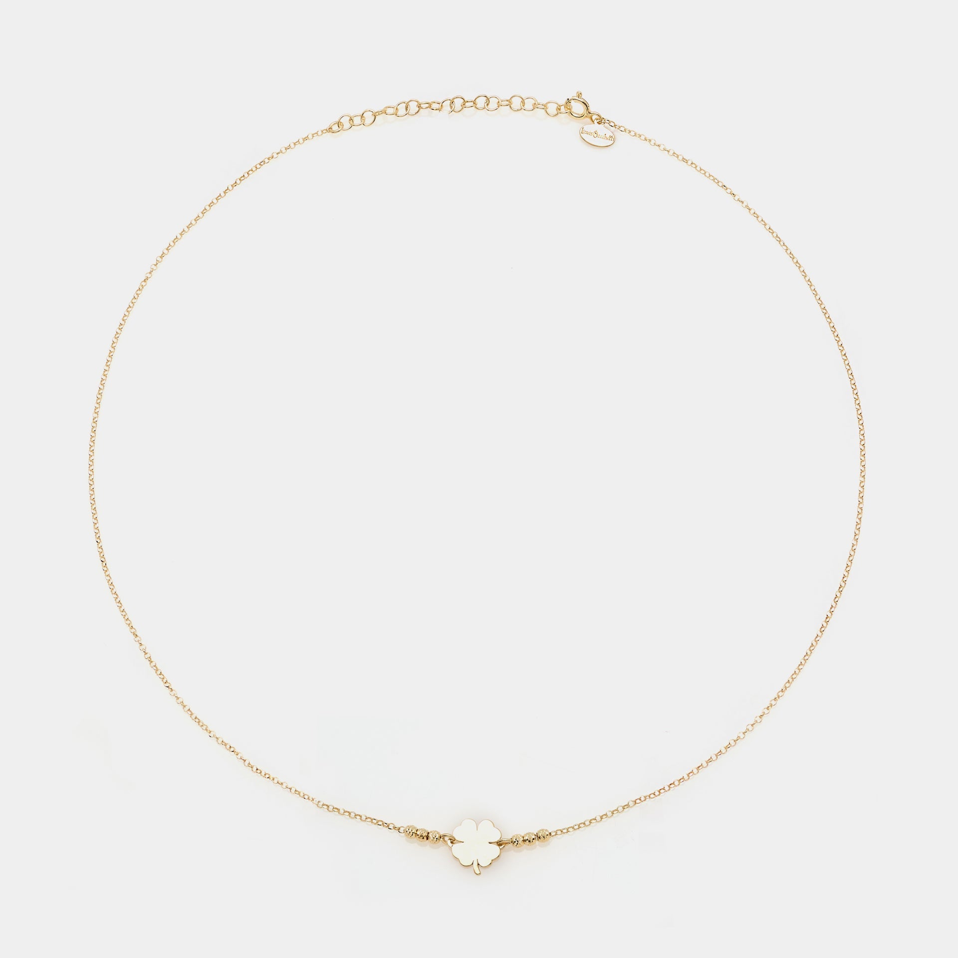Gold-plated silver necklace with clover centerpiece and 3 faceted spheres on the sides