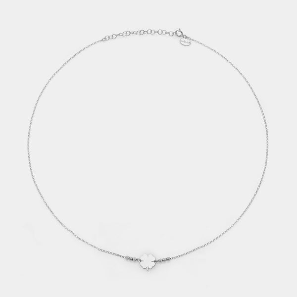 Rhodium-plated silver necklace with clover centerpiece and 3 faceted spheres on the sides