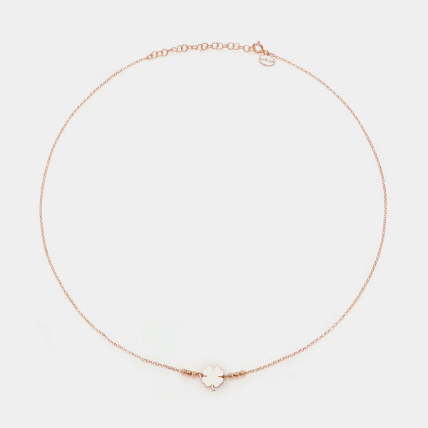 Rose gold silver necklace with clover centerpiece and 3 faceted spheres on the sides