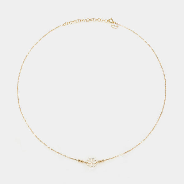 Gold-plated silver necklace with a central four-leaf clover with heart-shaped cutout petals and 3 faceted spheres on the sides