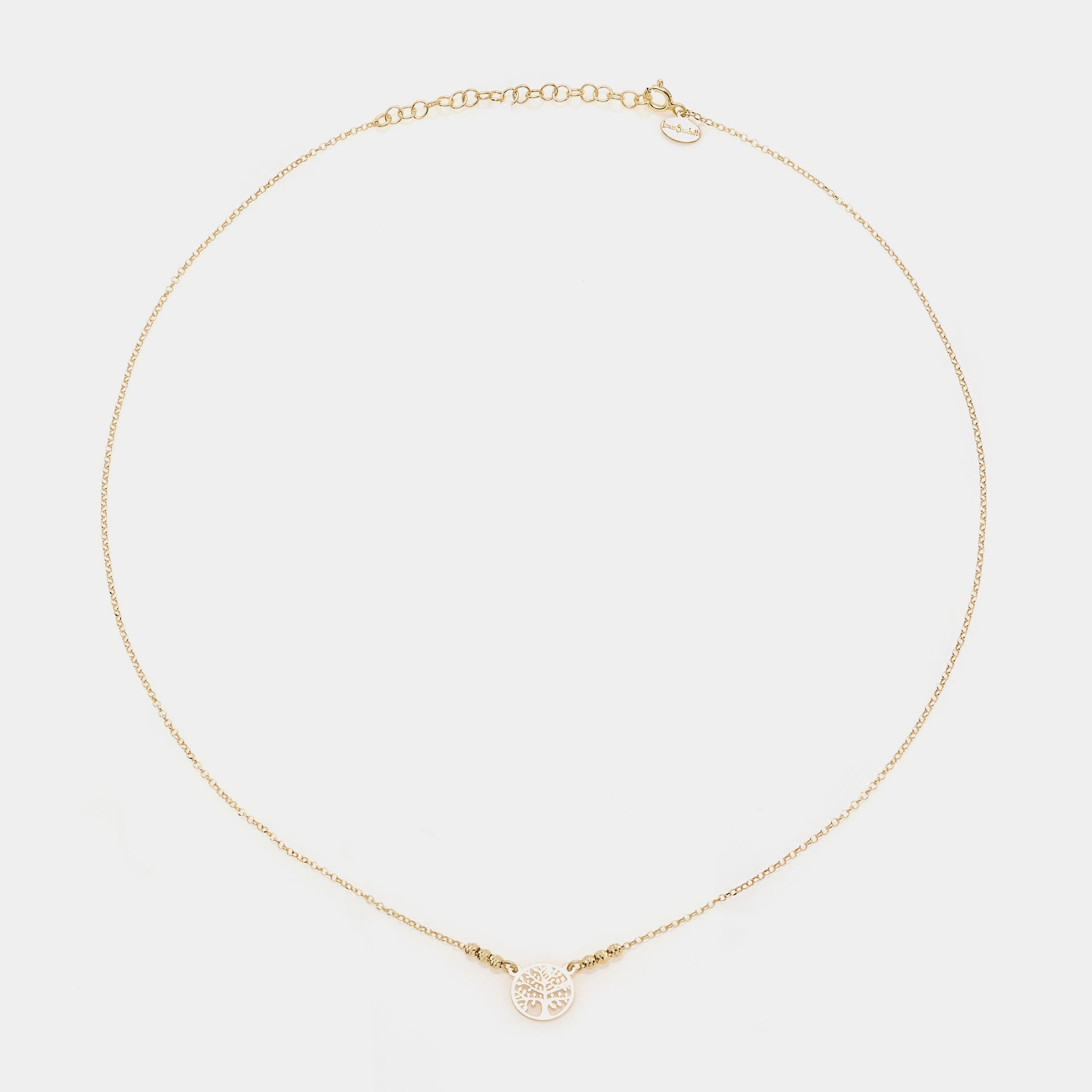 Gold-plated silver necklace with round pierced tree of life centerpiece and 3 faceted spheres on the sides