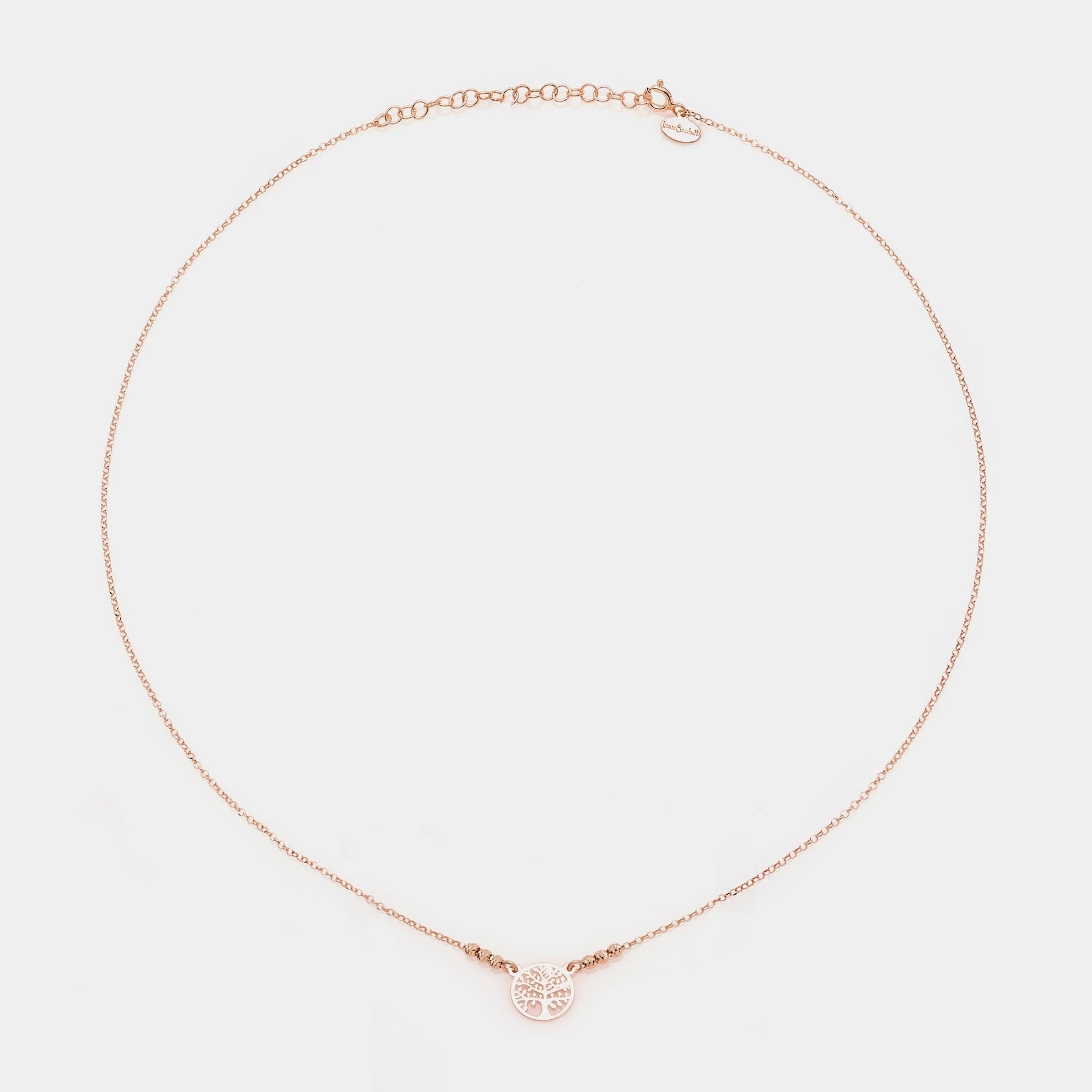 Rose gold silver necklace with round pierced tree of life centerpiece and 3 faceted spheres on the sides