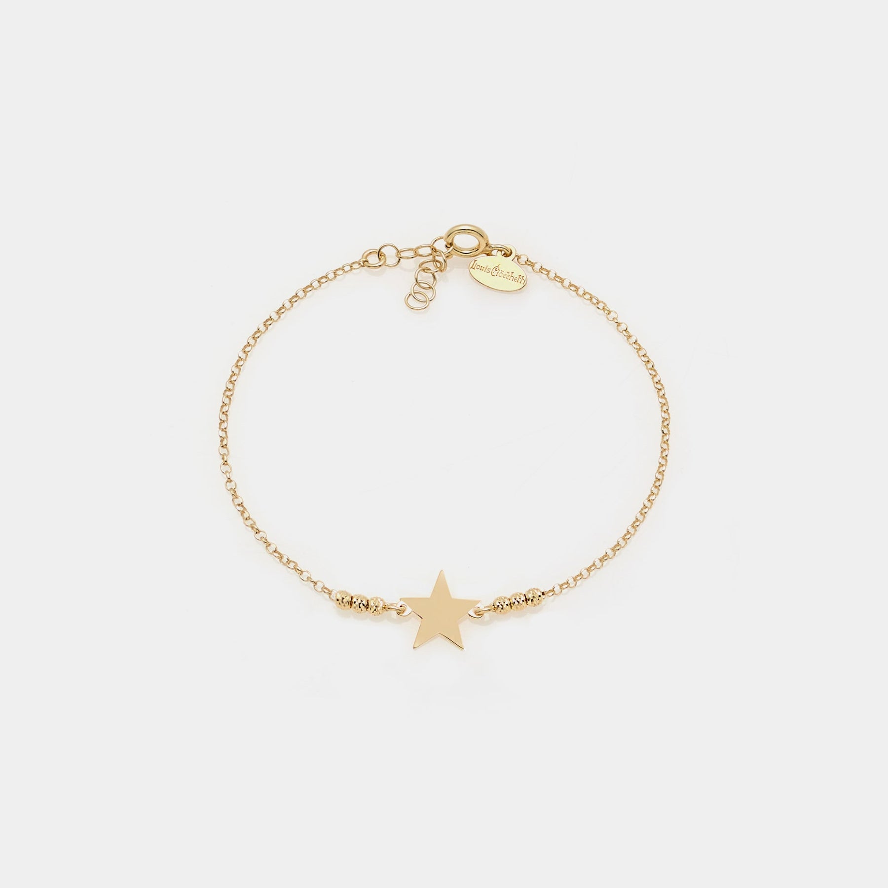 Gold-plated silver bracelet with faceted spheres and central star
