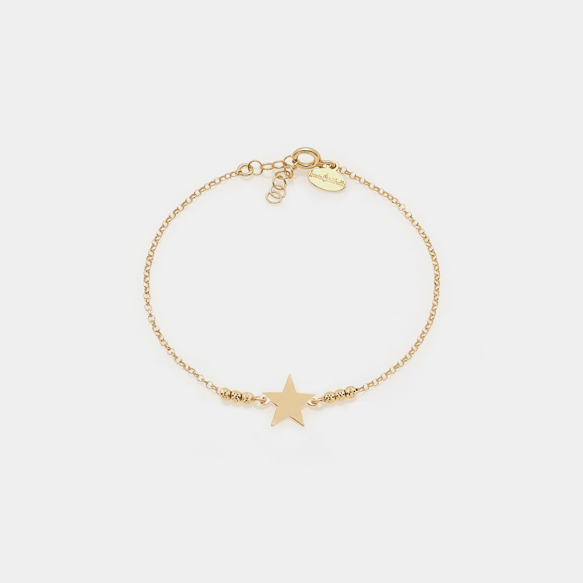 Gold-plated silver bracelet with faceted spheres and central star