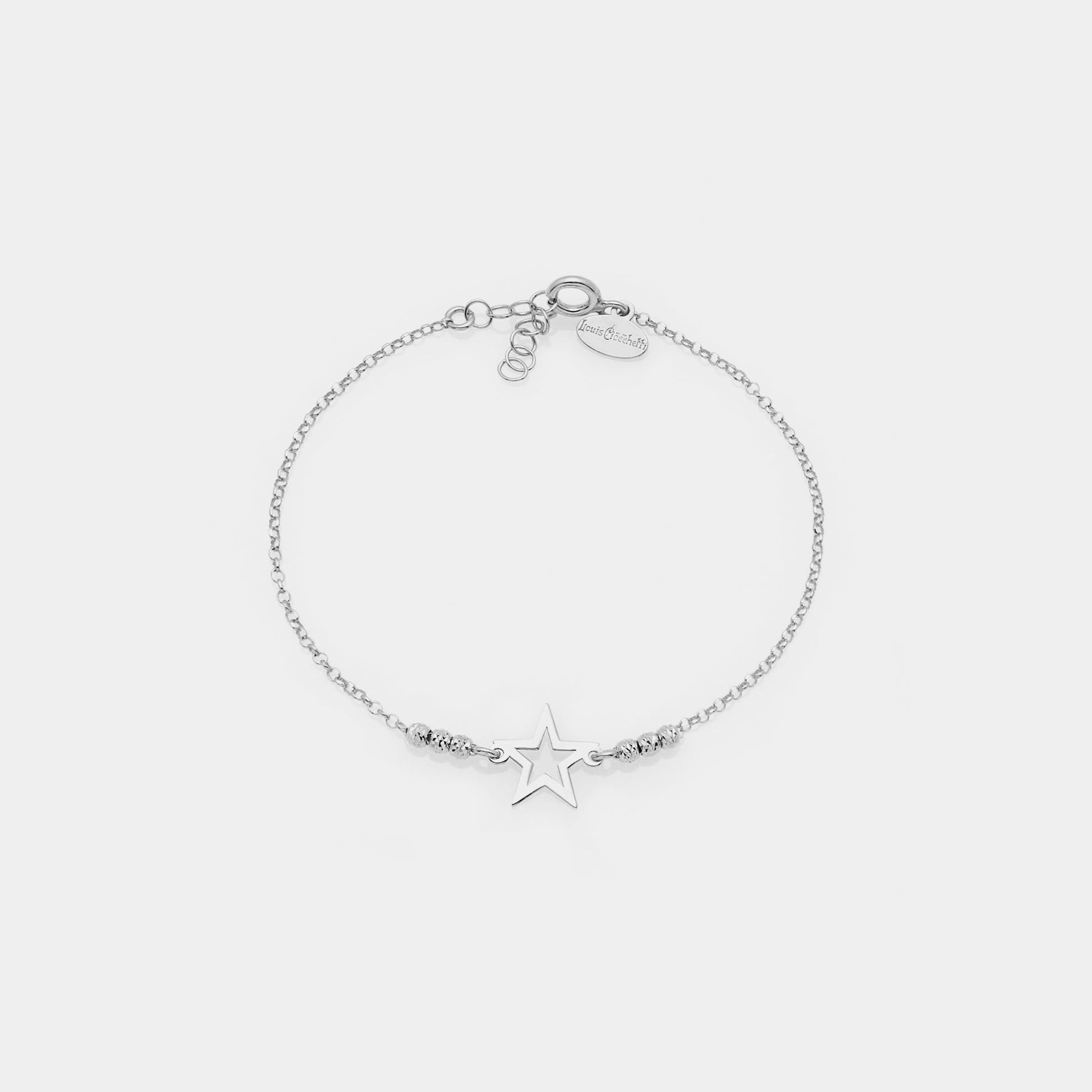 Rhodium-plated silver bracelet with faceted spheres and central pierced star