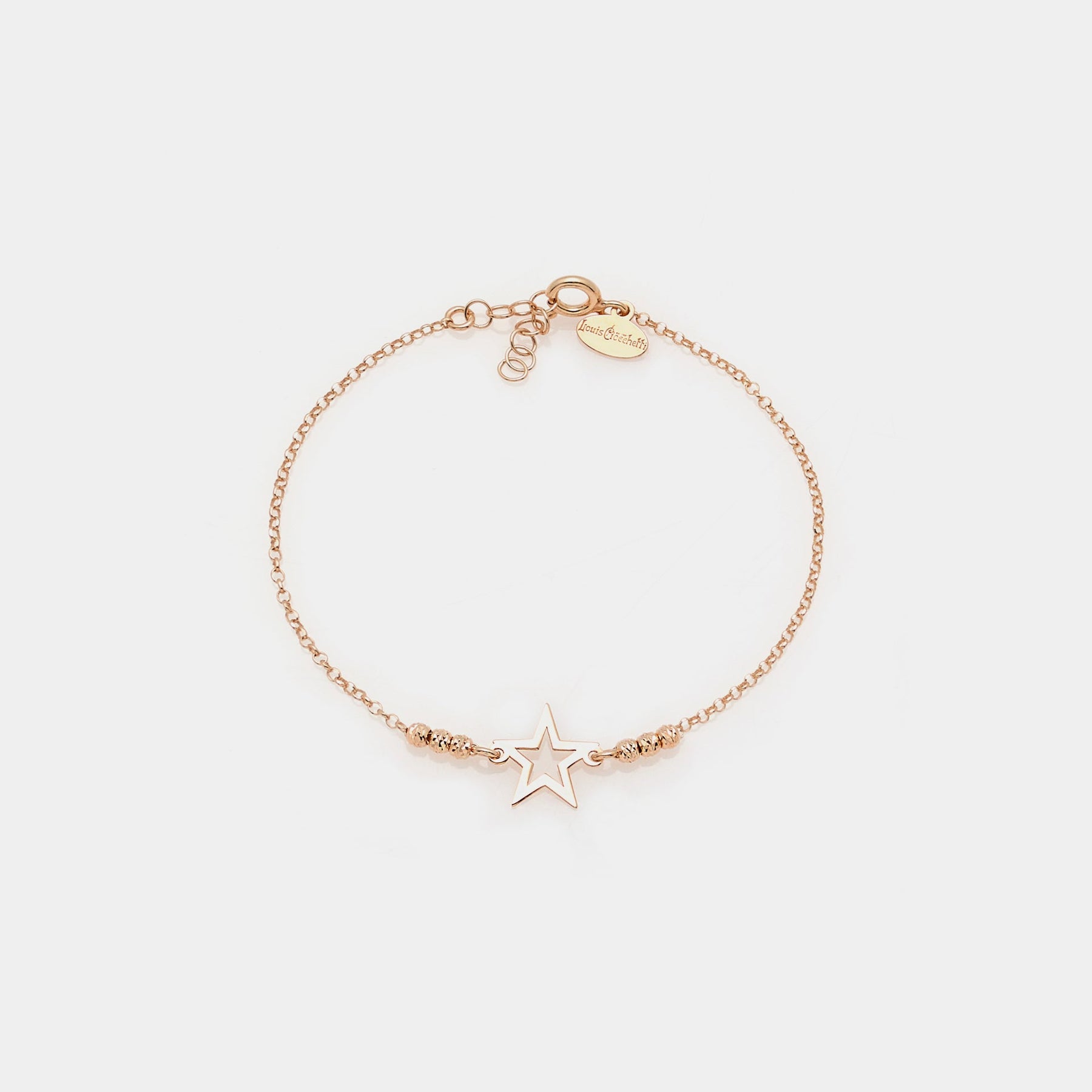 Rose gold plated silver bracelet with faceted spheres and central pierced star
