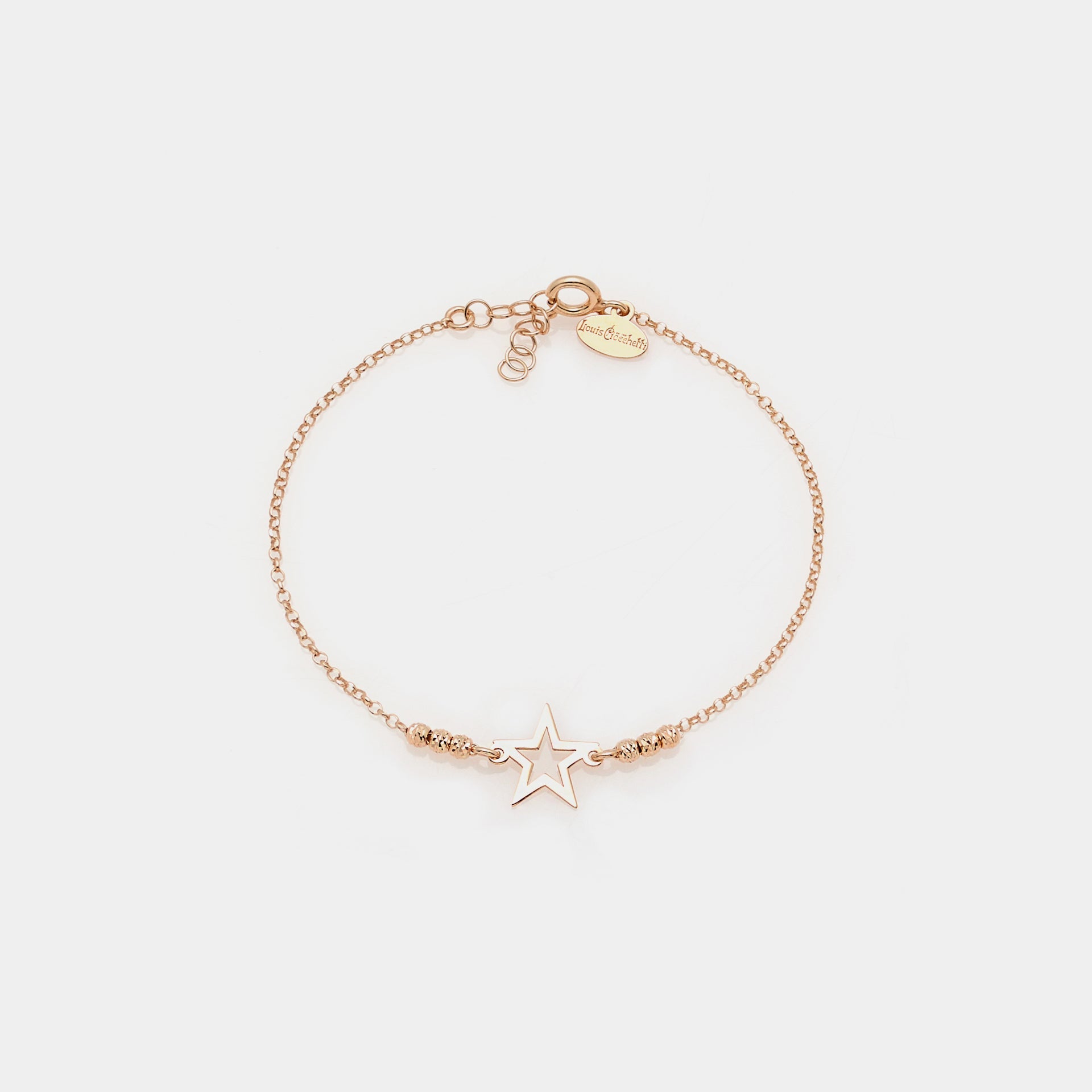 Rose gold plated silver bracelet with faceted spheres and central pierced star