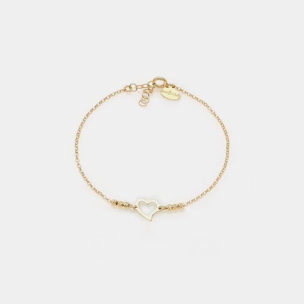 Gold-plated silver bracelet with faceted spheres and central twisted pierced heart