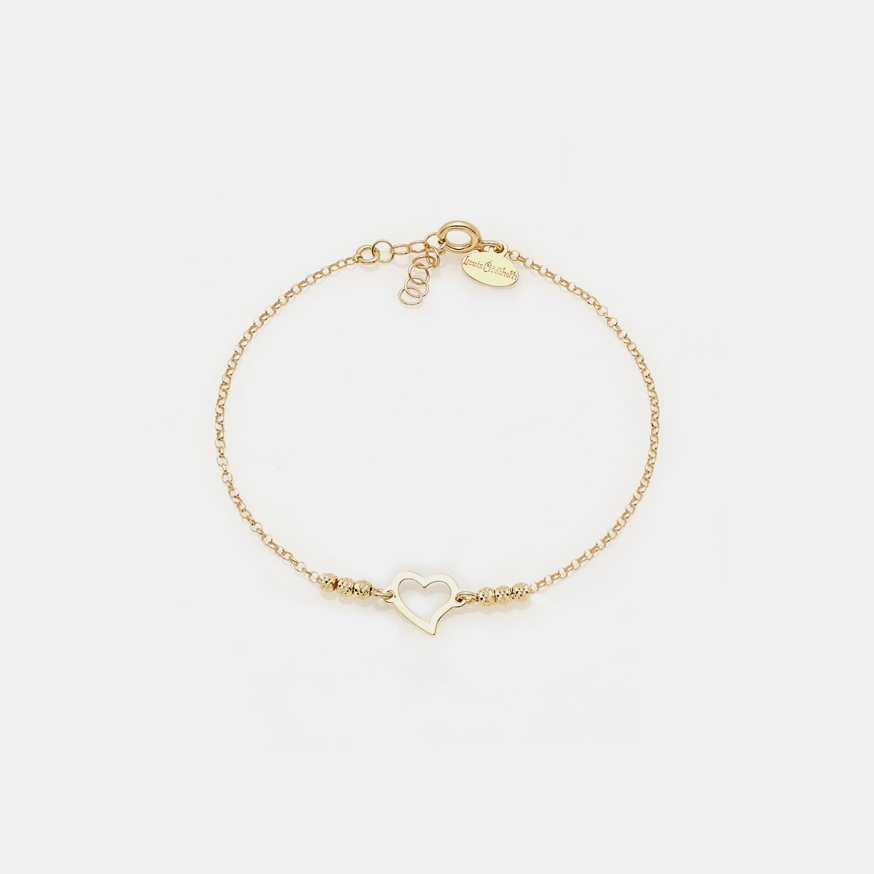 Bracciale argento dorato con sfere sfaccettate e cuore storto traforato centrale