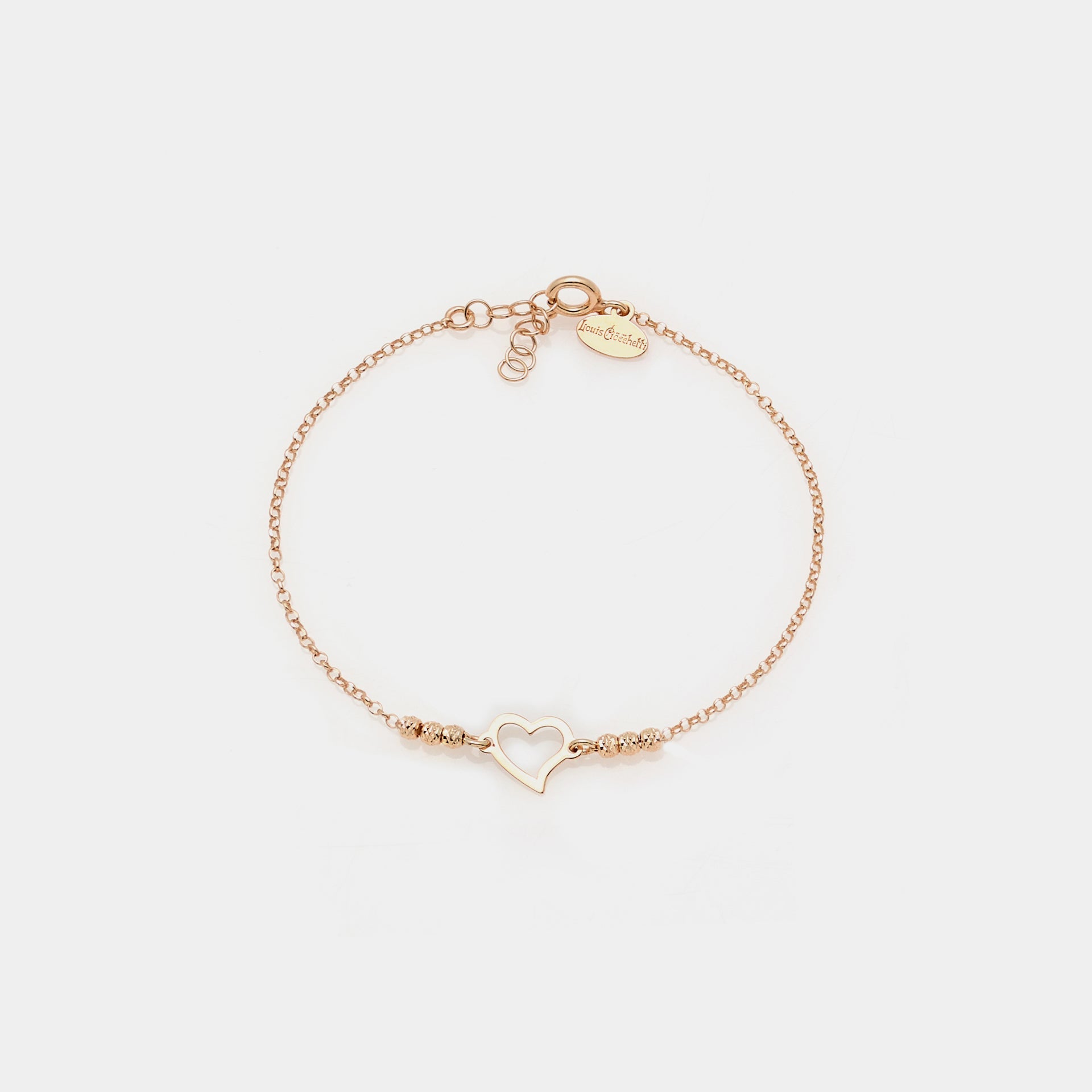 Rose gold plated silver bracelet with faceted spheres and central pierced twisted heart