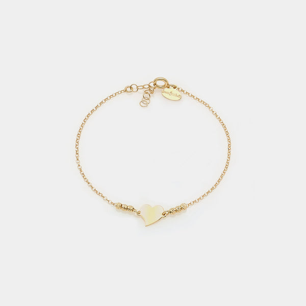 Bracciale argento dorato con sfere sfaccettate e cuore storto centrale