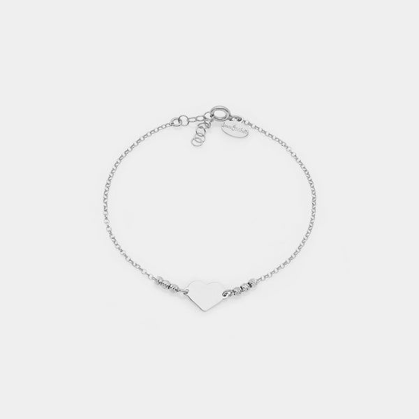 Pulsera de plata chapada en rodio con esferas facetadas y corazón central