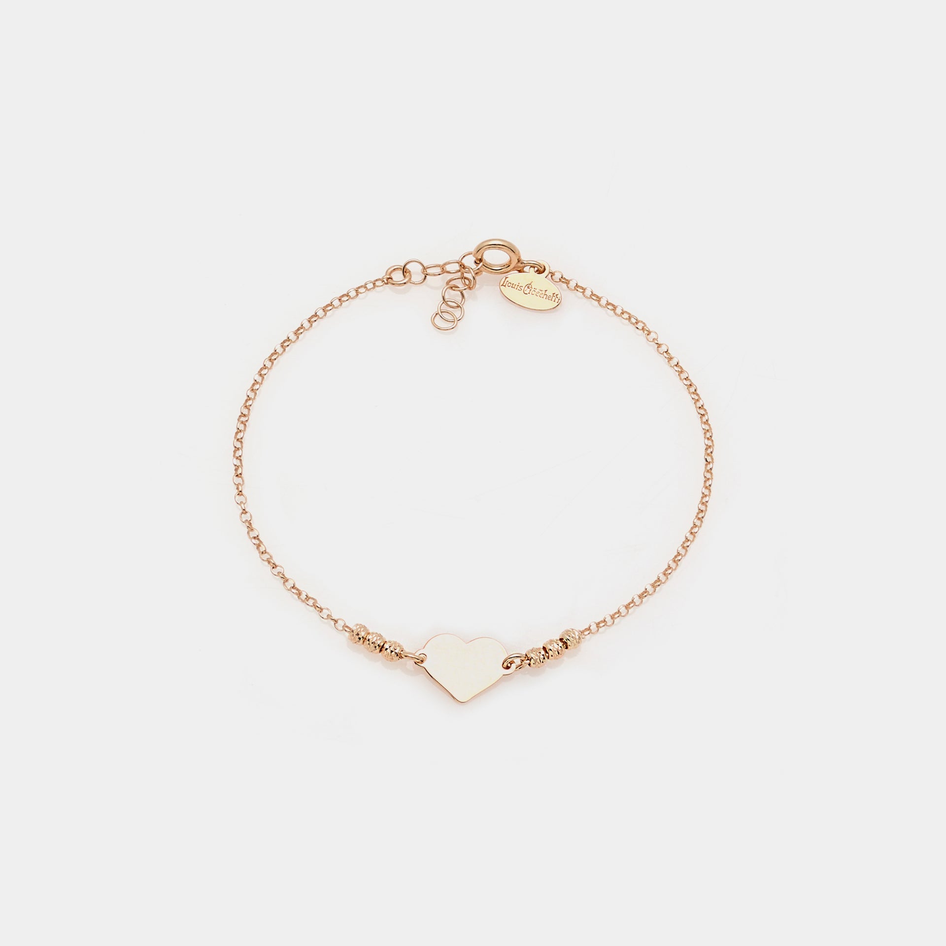 Rose gold plated silver bracelet with faceted spheres and central heart