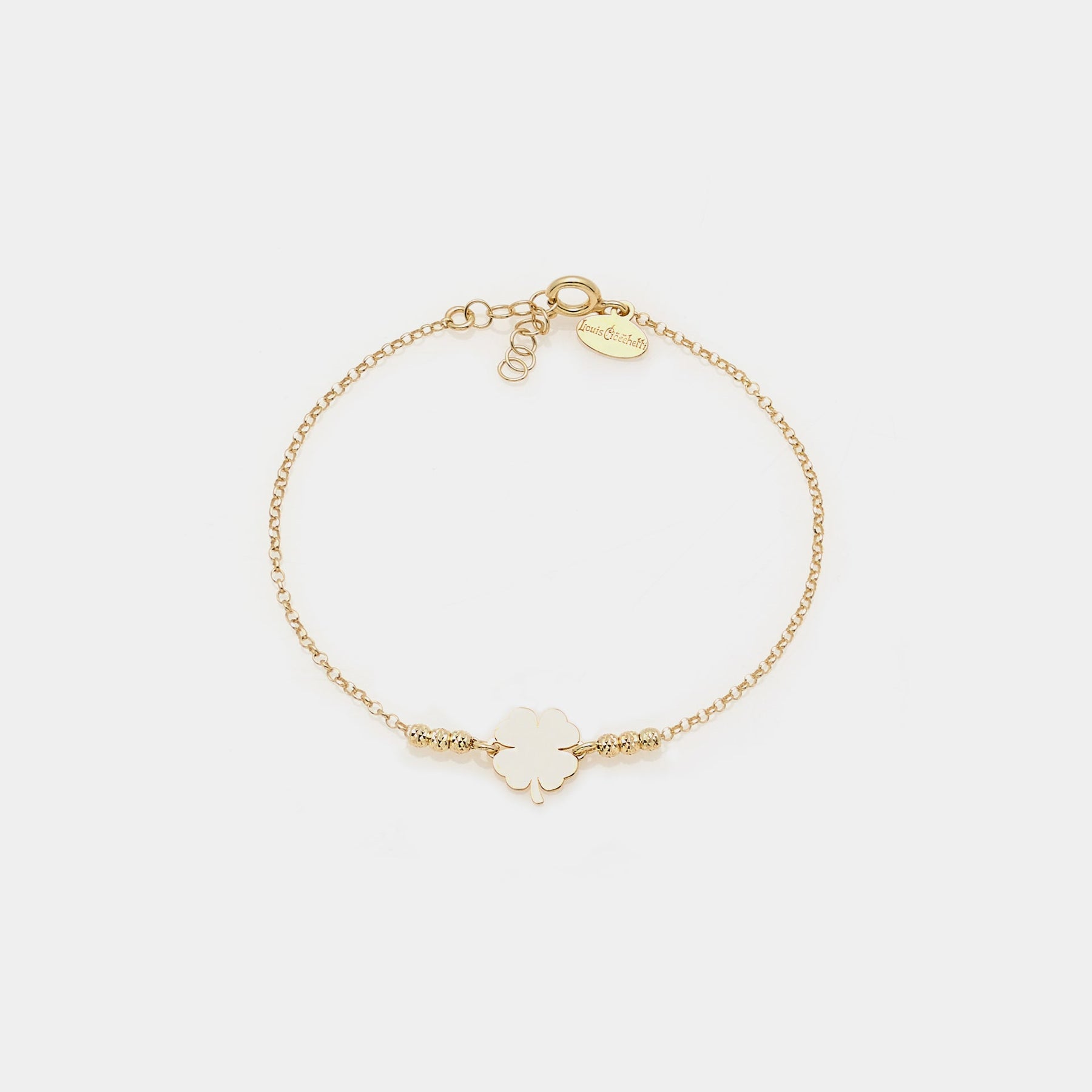 Gold-plated silver bracelet with faceted spheres and central four-leaf clover
