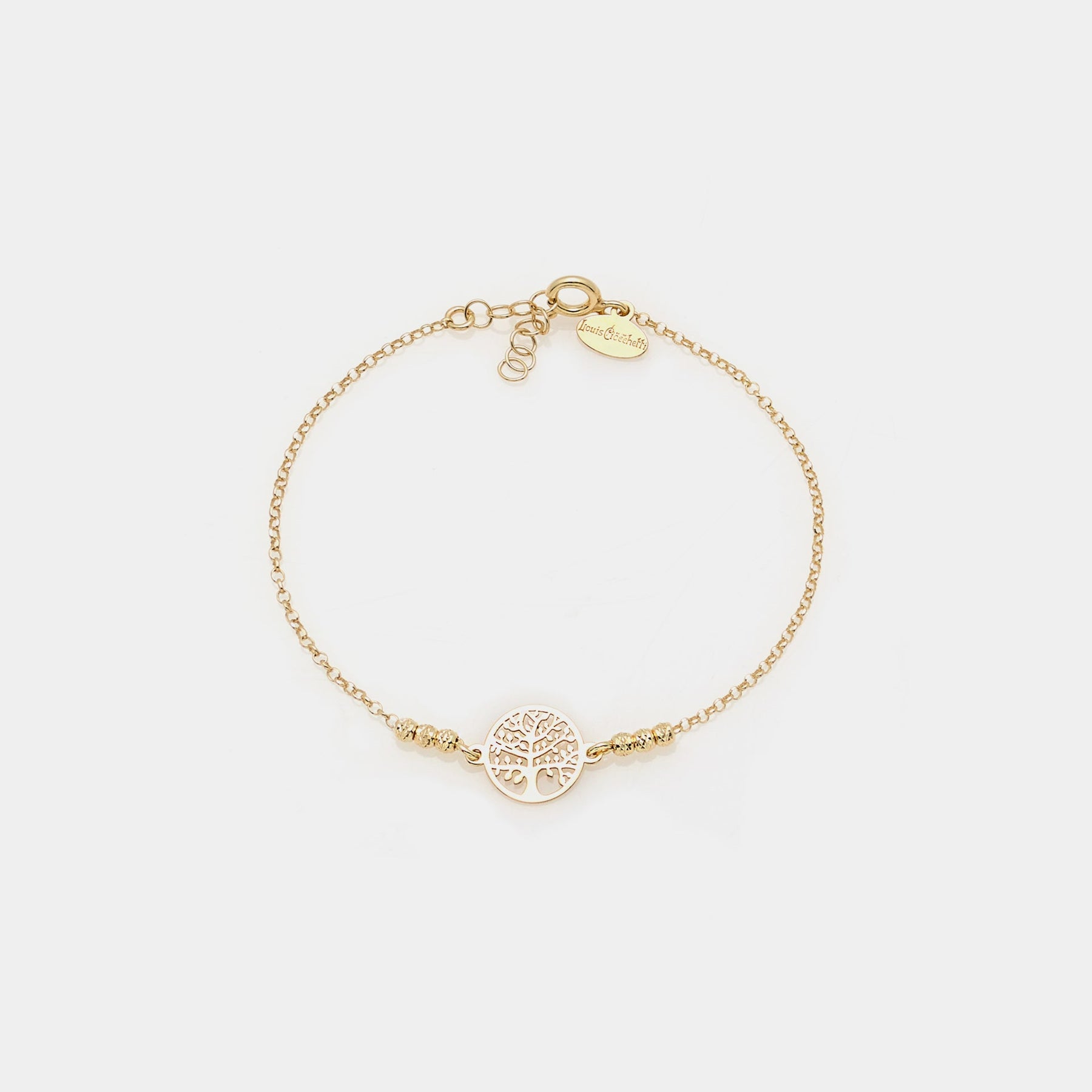 Gold-plated silver bracelet with faceted spheres and pierced round tree of life centerpiece