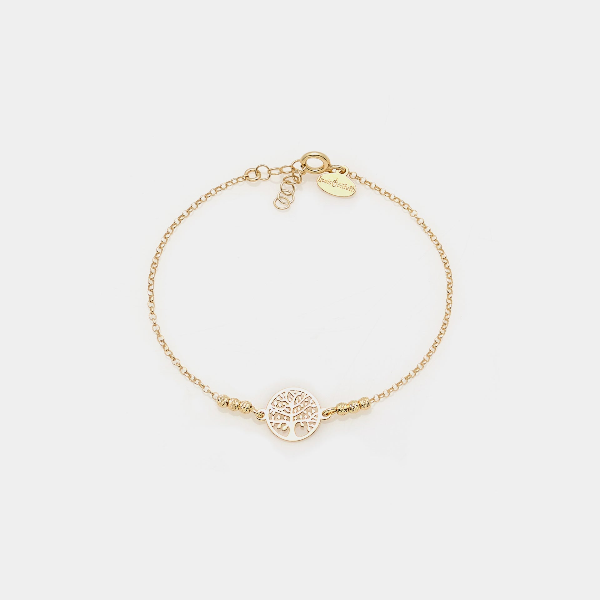 Gold-plated silver bracelet with faceted spheres and pierced round tree of life centerpiece