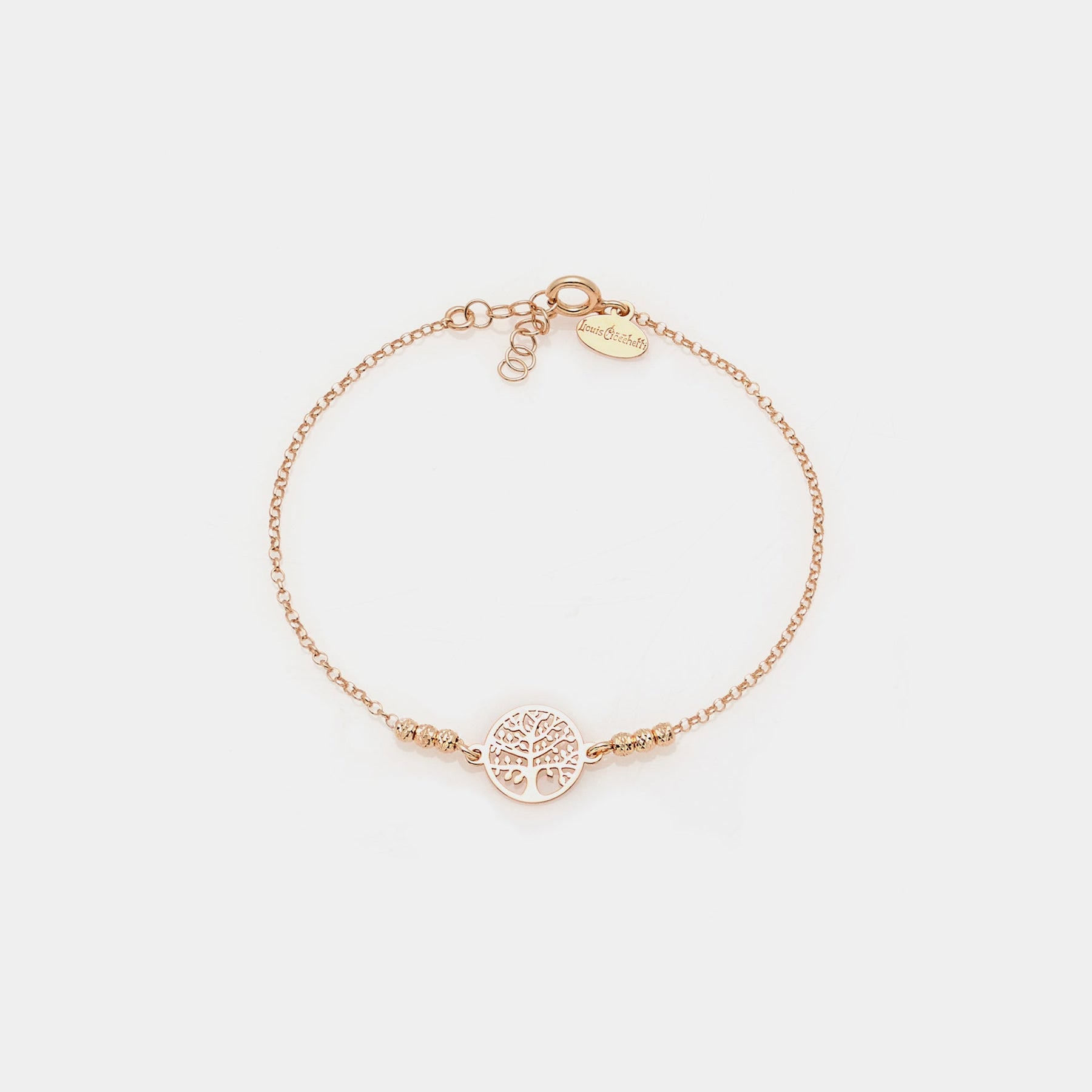 Rose gold plated silver bracelet with faceted spheres and central round cut-out tree of life