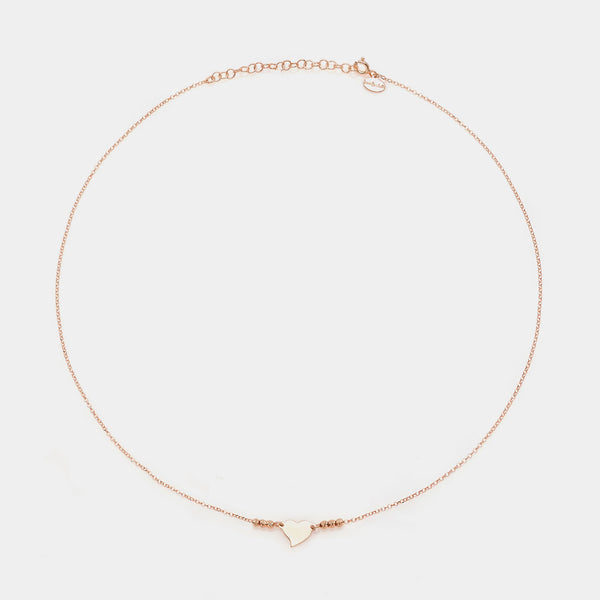 Rose gold silver necklace with twisted heart centerpiece and 3 faceted spheres on the sides