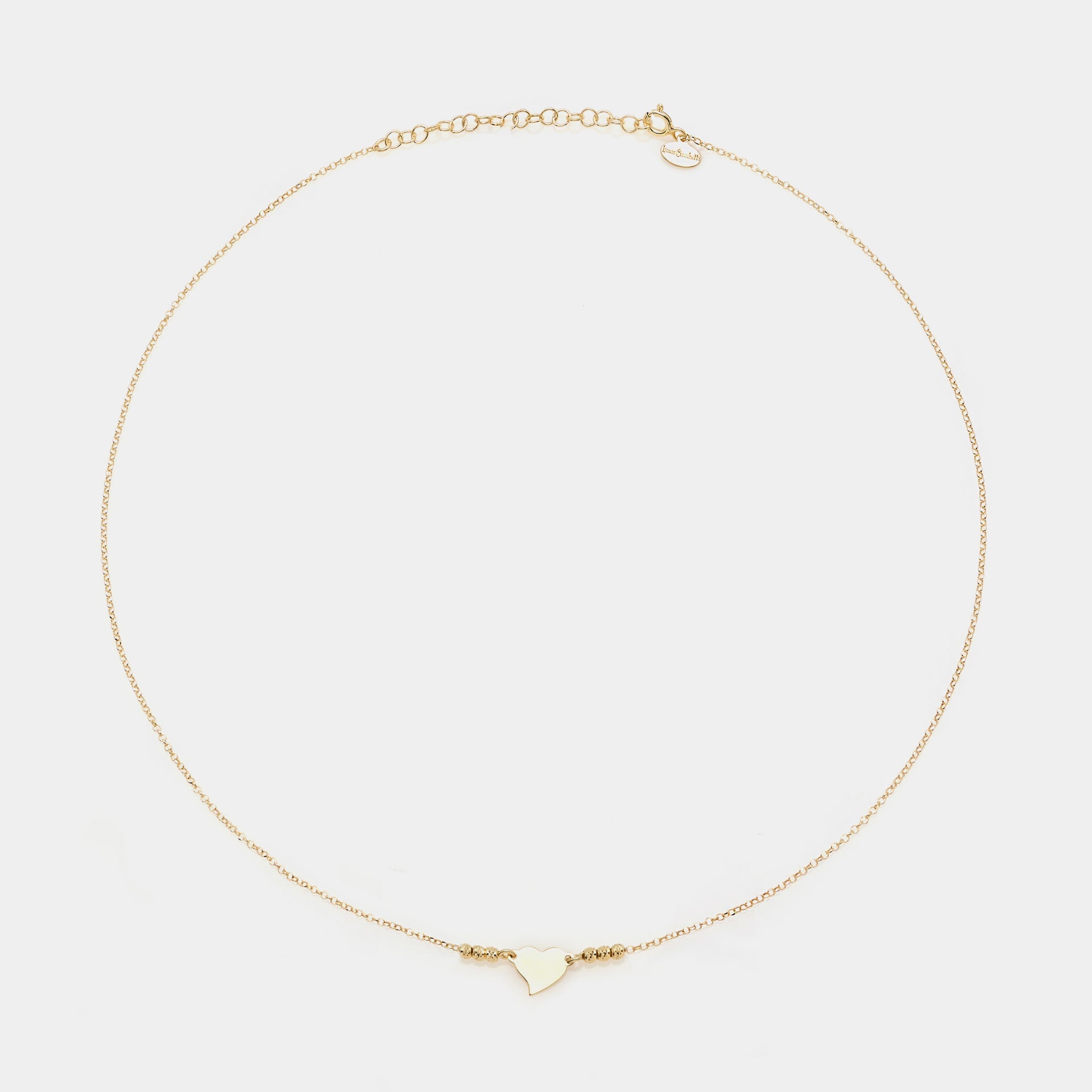 Gold-plated silver necklace with twisted heart centerpiece and 3 faceted spheres on the sides