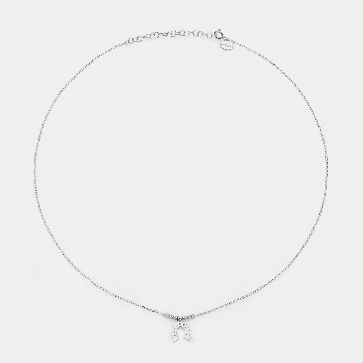 Rhodium-plated silver necklace with central horseshoe pendant and 3 faceted spheres on the sides