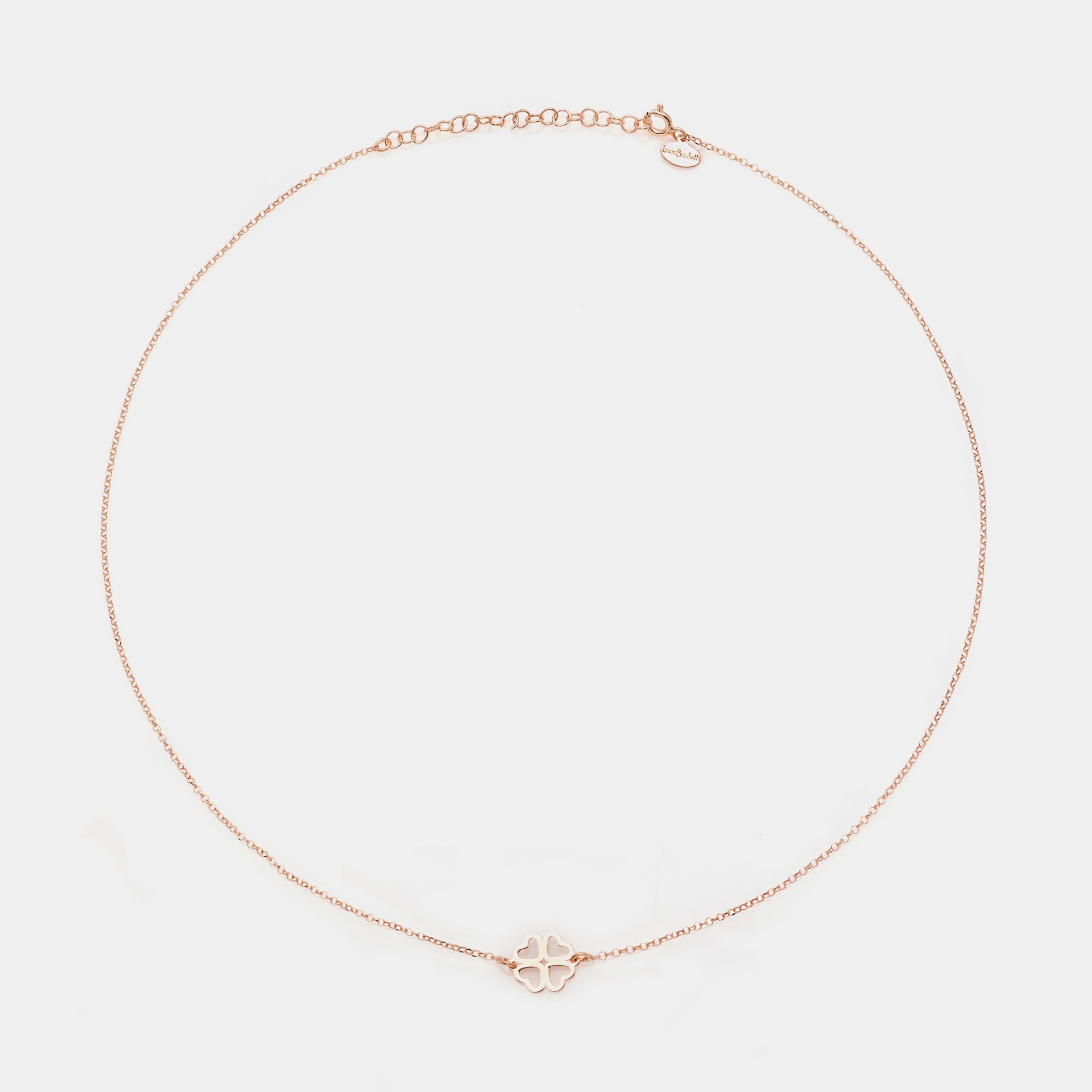 Rose gold silver necklace with clover centerpiece and heart-shaped cutout petals