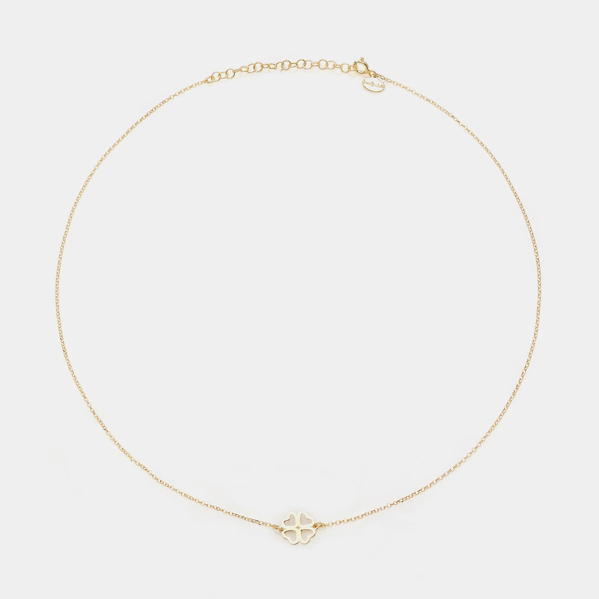 Gold-plated silver necklace with a clover centerpiece and heart-shaped cutout petals
