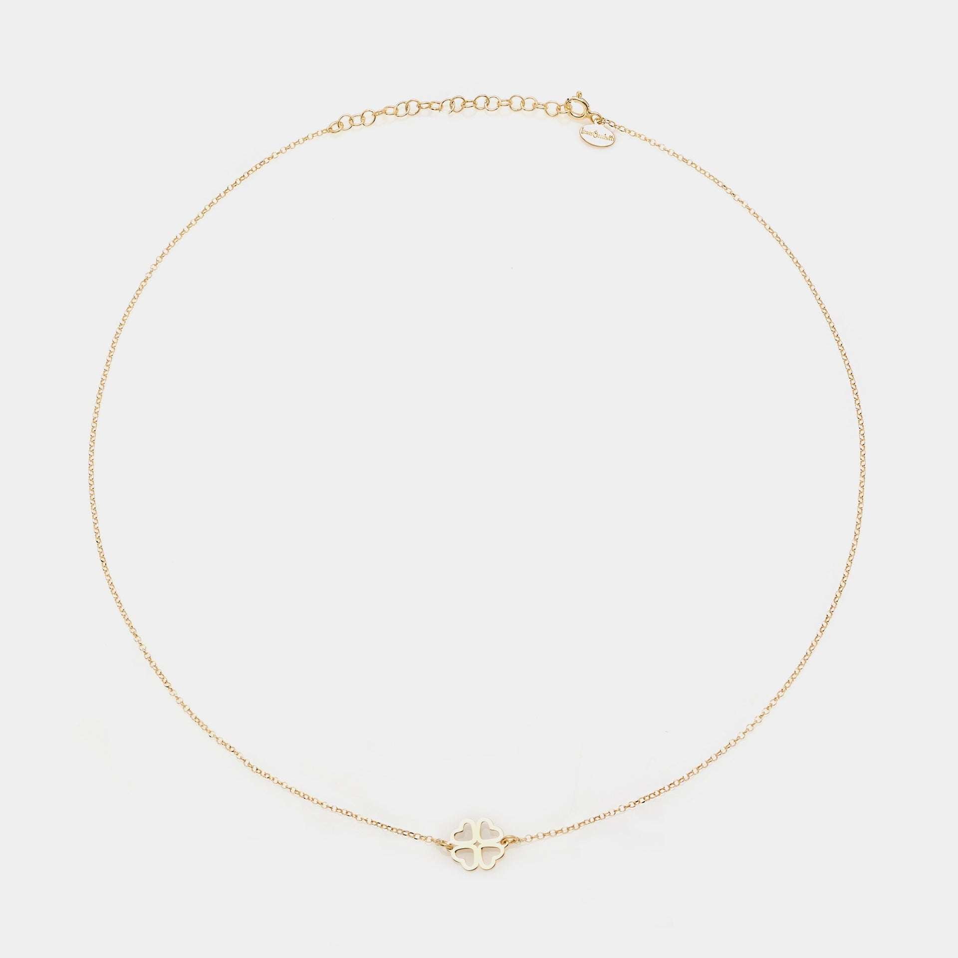 Gold-plated silver necklace with a clover centerpiece and heart-shaped cutout petals