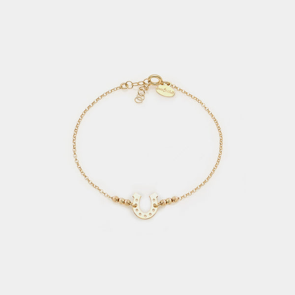 Gold-plated silver bracelet with faceted spheres and central horseshoe