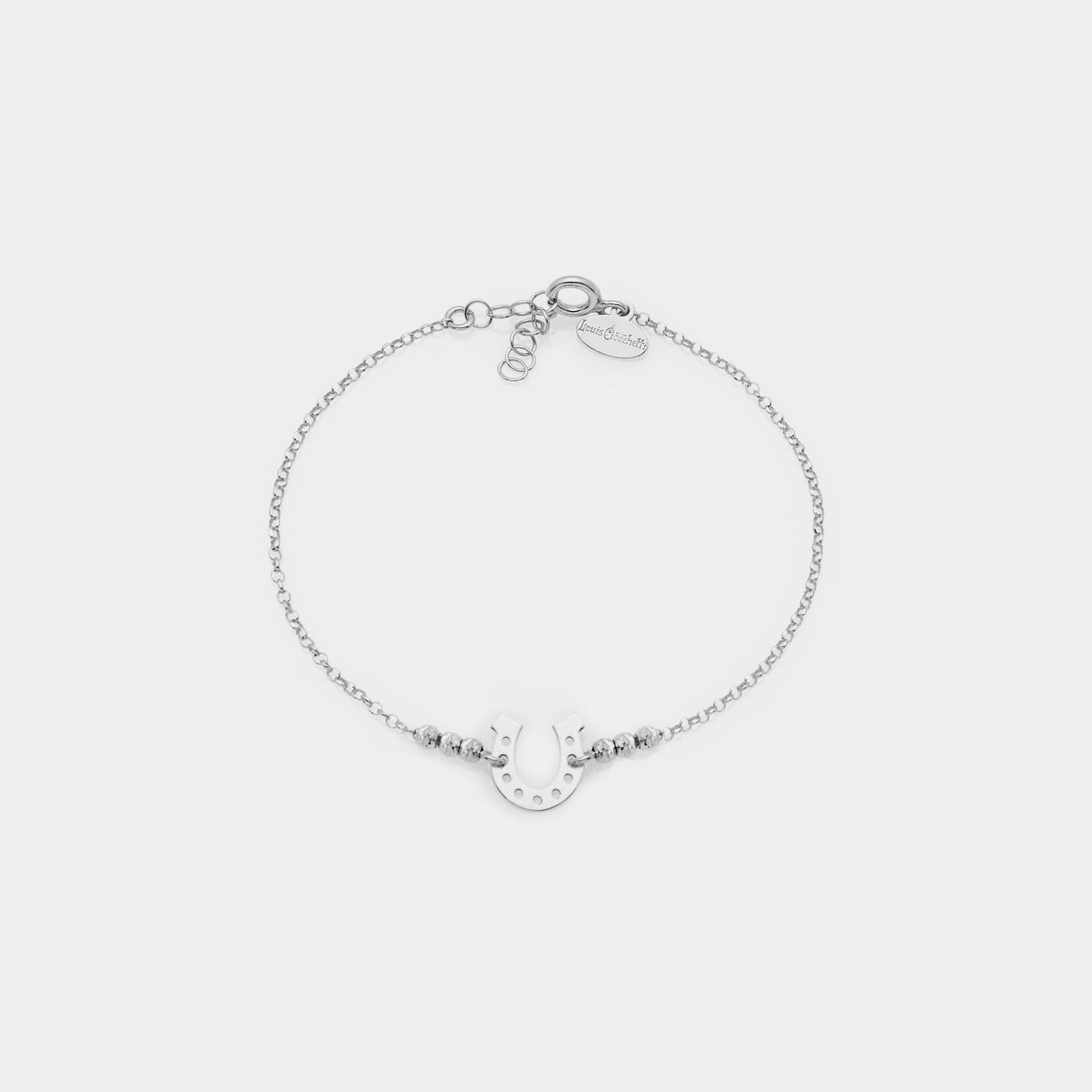 Rhodium-plated silver bracelet with faceted spheres and central horseshoe