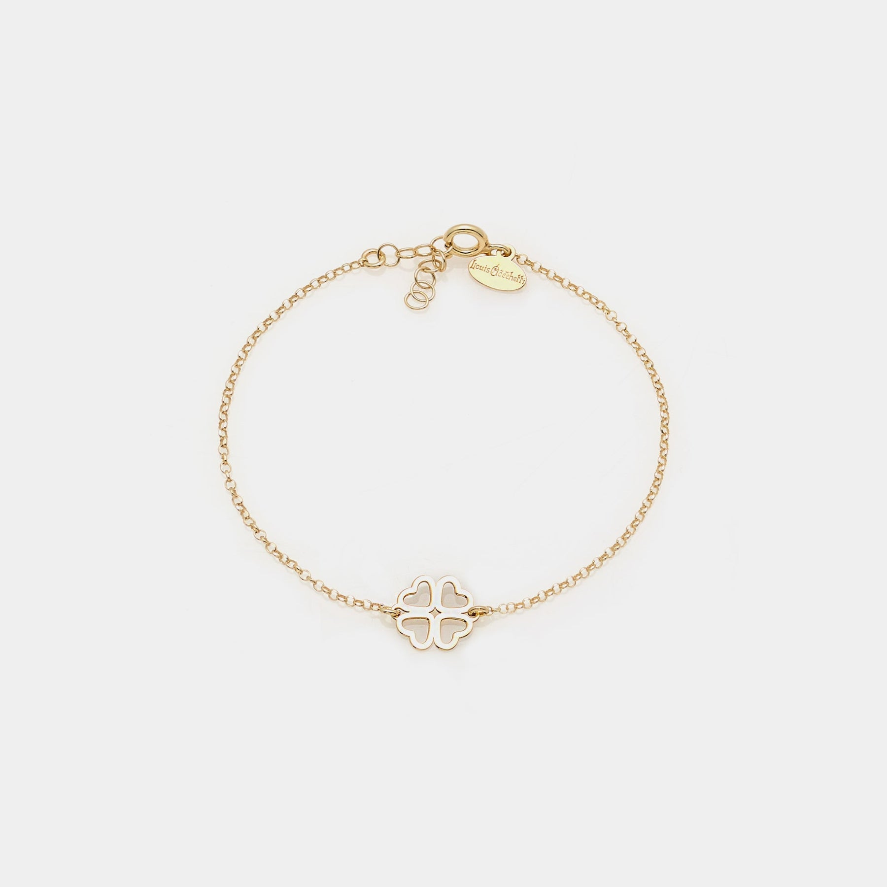 Gold-plated silver bracelet with clover centerpiece and heart-shaped perforated petals