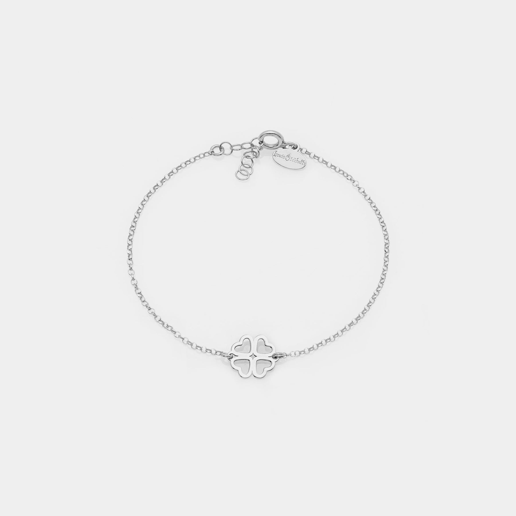 Rhodium-plated silver bracelet with clover centerpiece and heart-shaped perforated petals