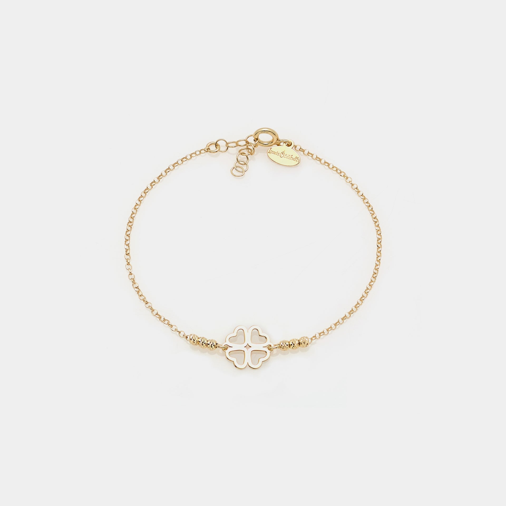 Gold-plated silver bracelet with faceted spheres and clover with heart-shaped central petals