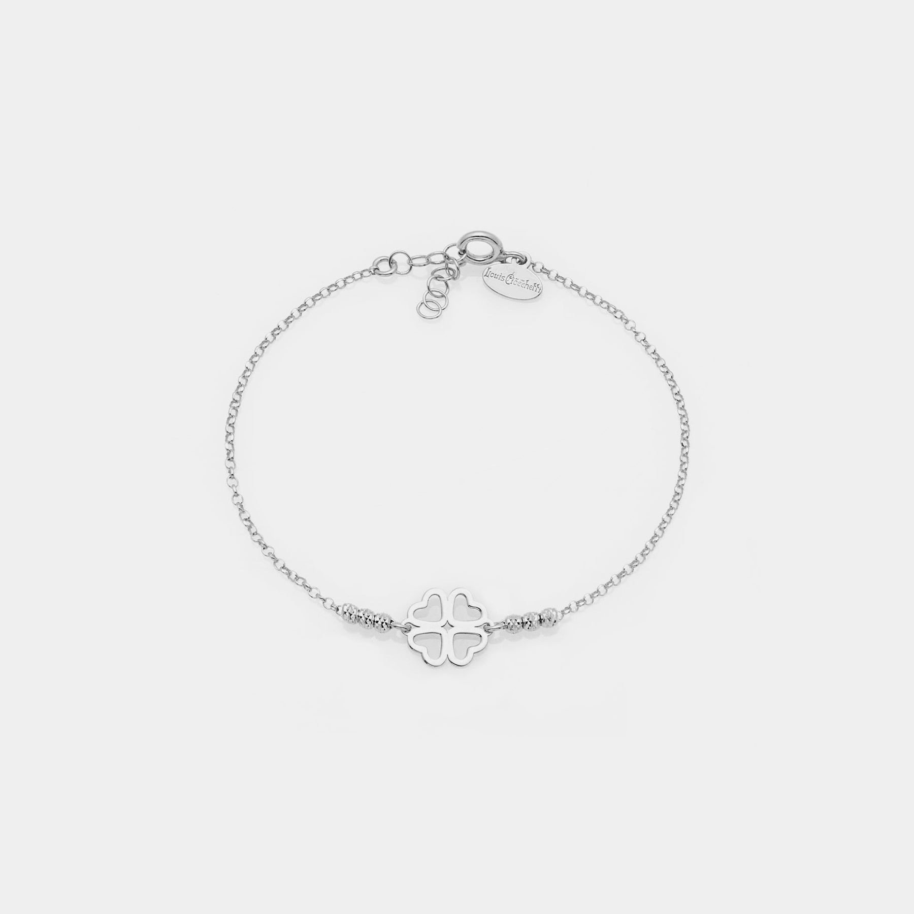 Rhodium-plated silver bracelet with faceted spheres and clover with heart-shaped petals