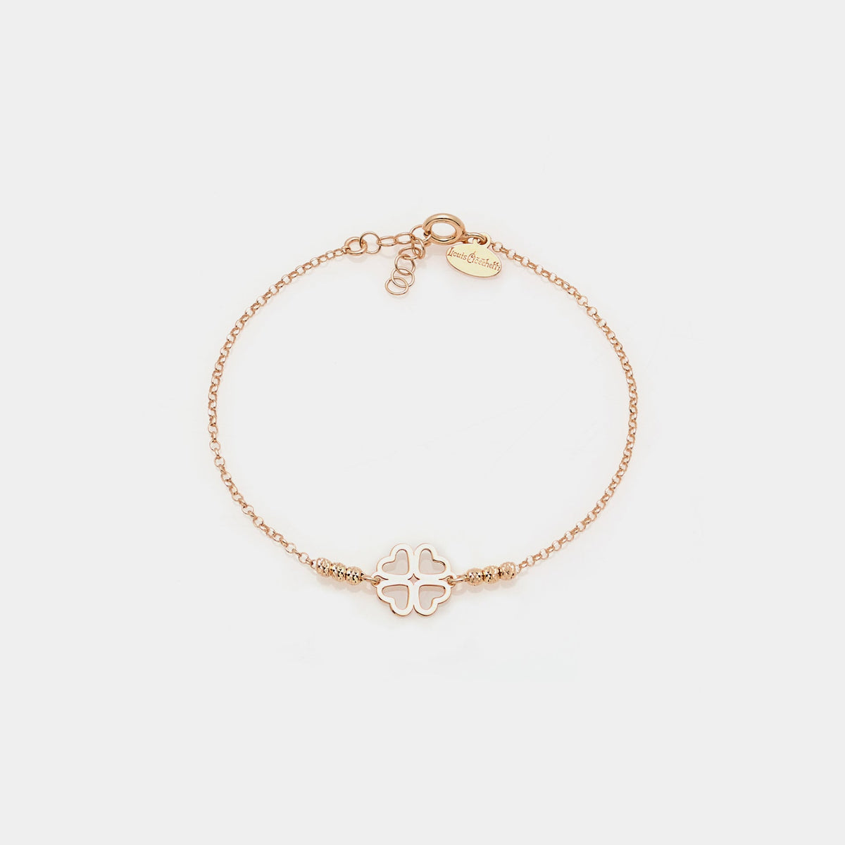 Rose gold silver bracelet with faceted spheres and clover with heart-shaped petals