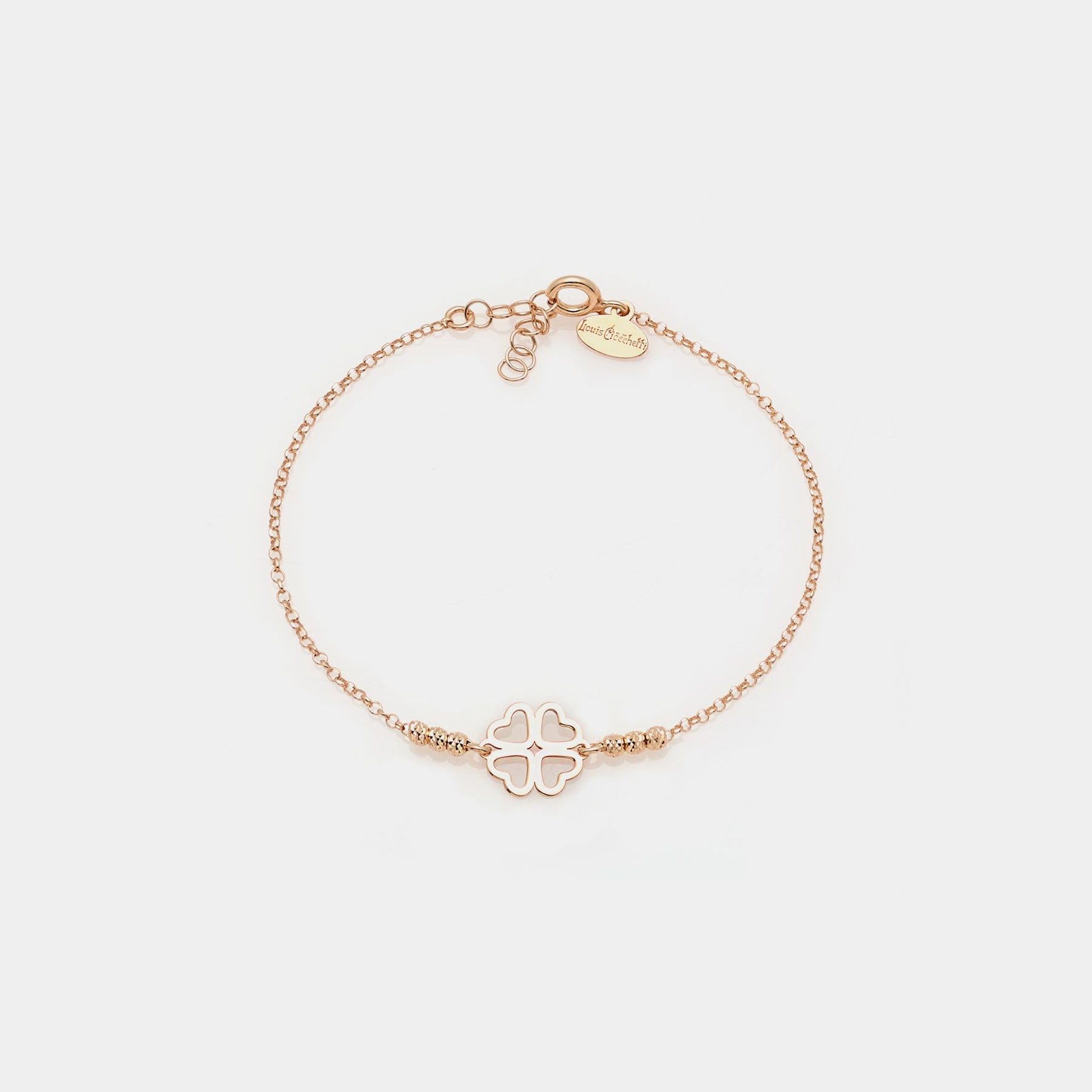 Rose gold silver bracelet with faceted spheres and clover with heart-shaped petals