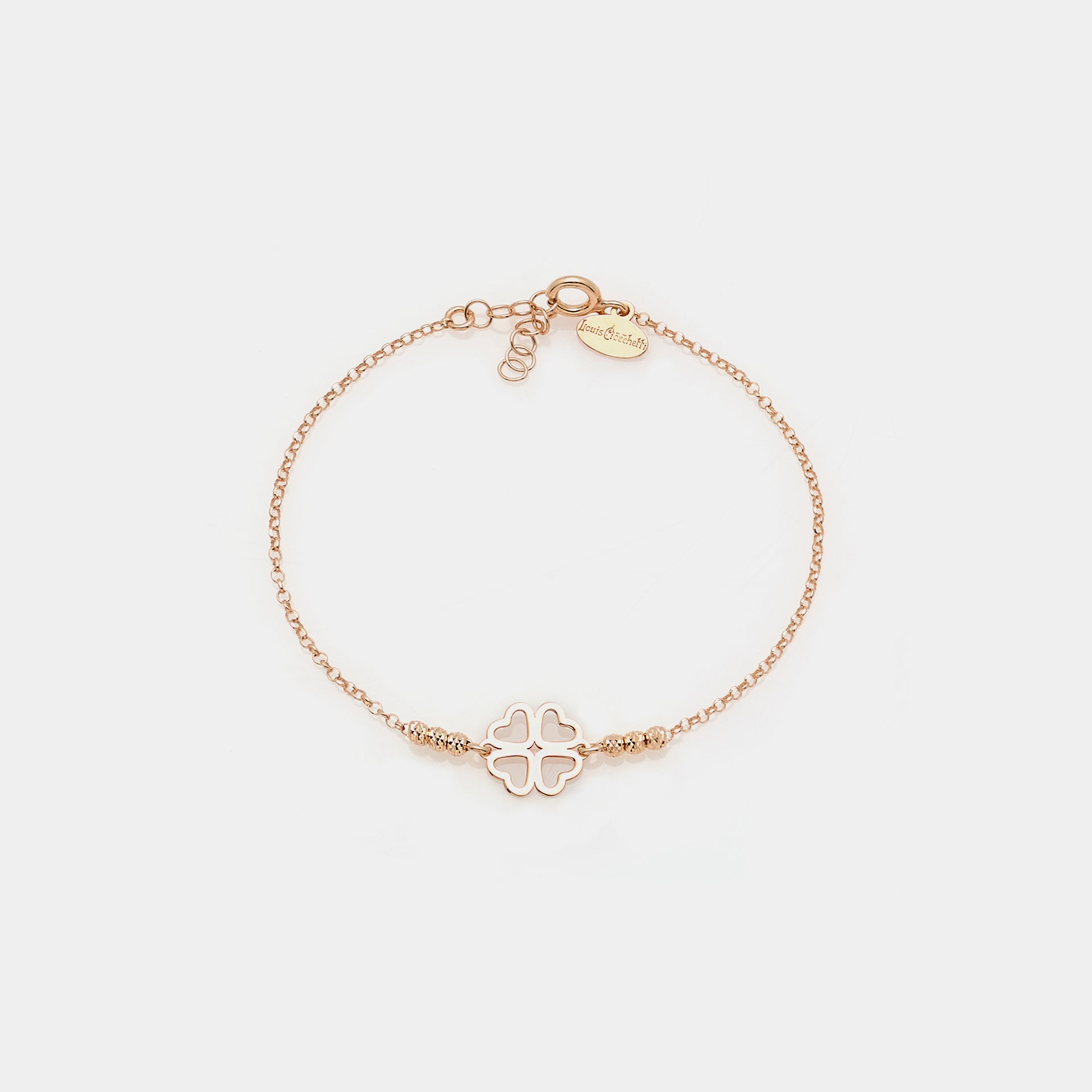 Rose gold silver bracelet with faceted spheres and clover with heart-shaped petals